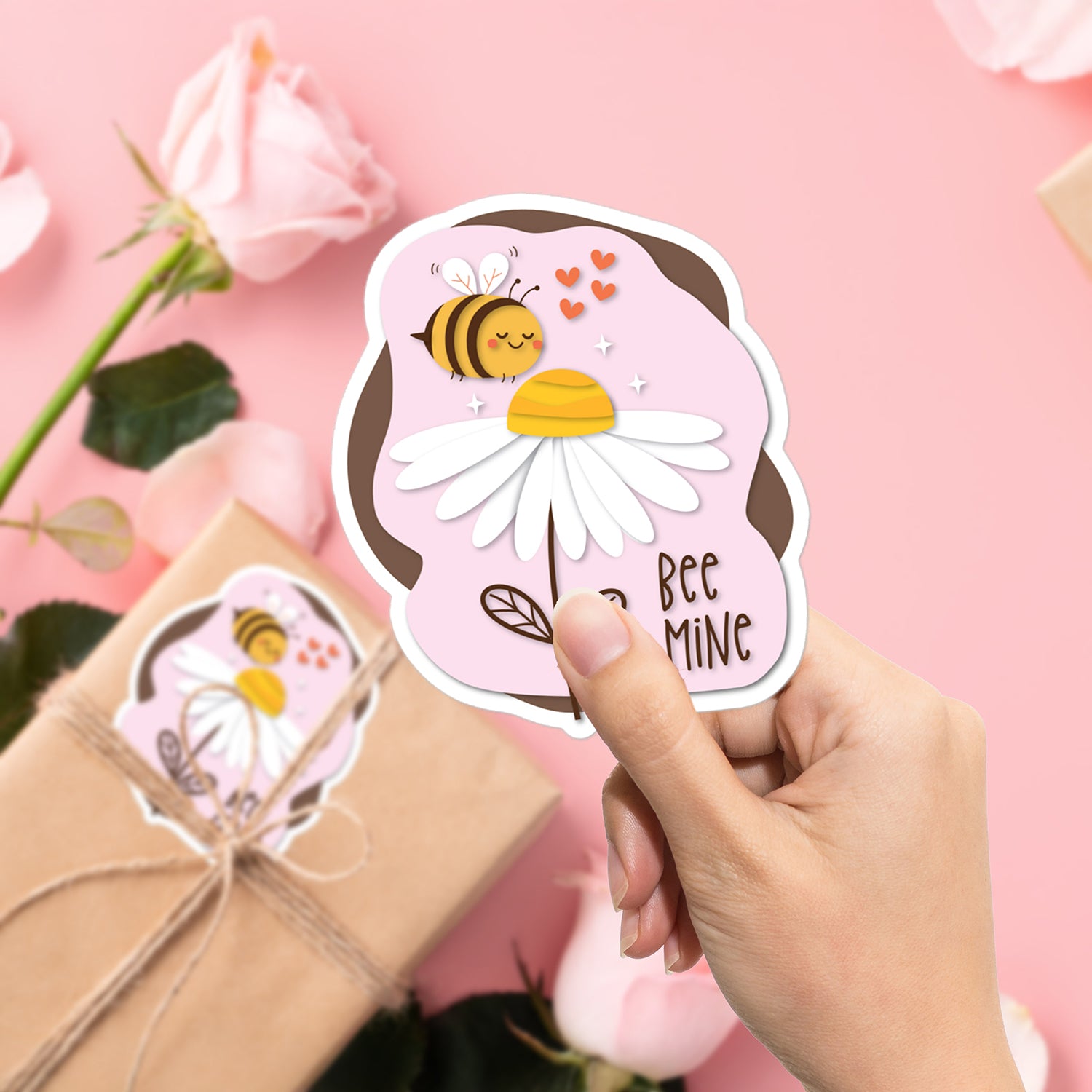 a person holding a sticker with a bee on it
