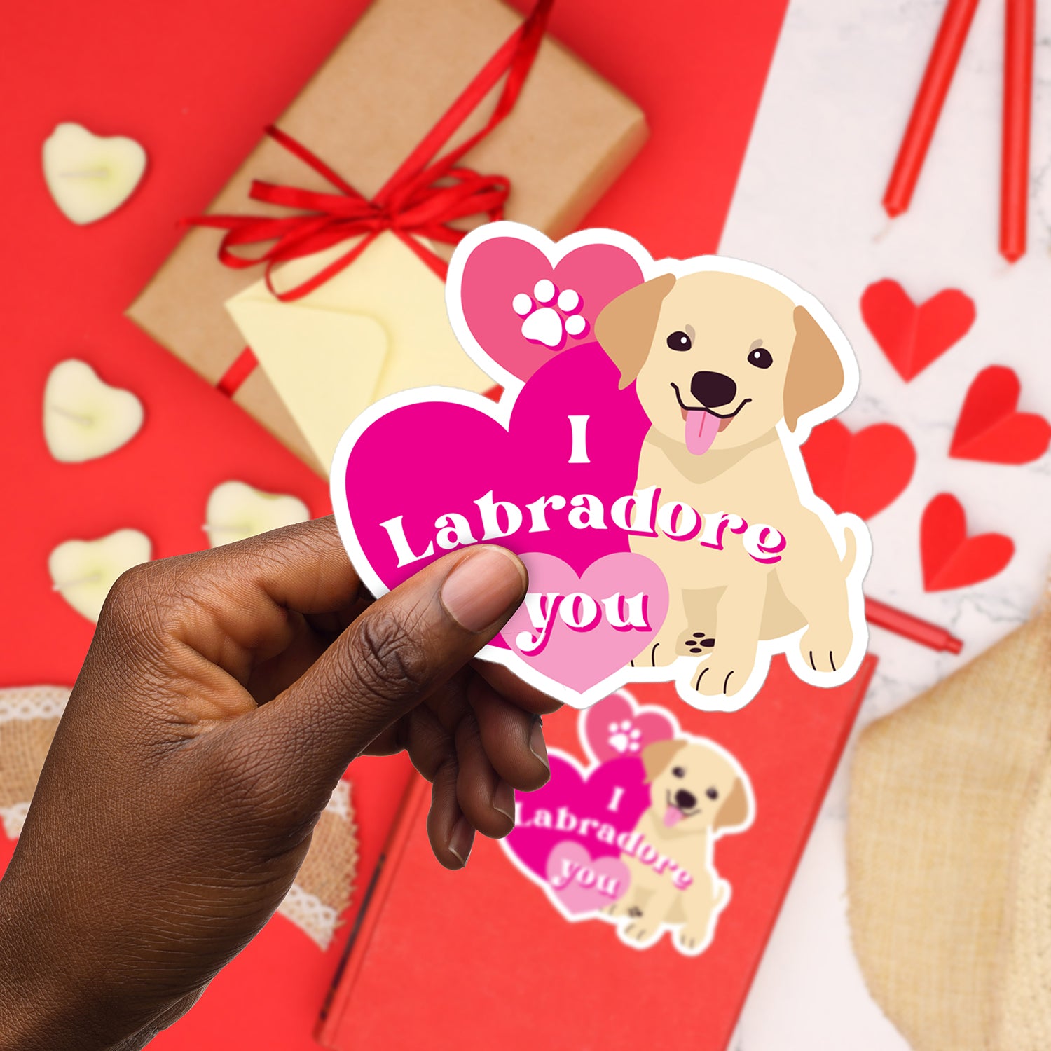a person holding a sticker with a dog on it