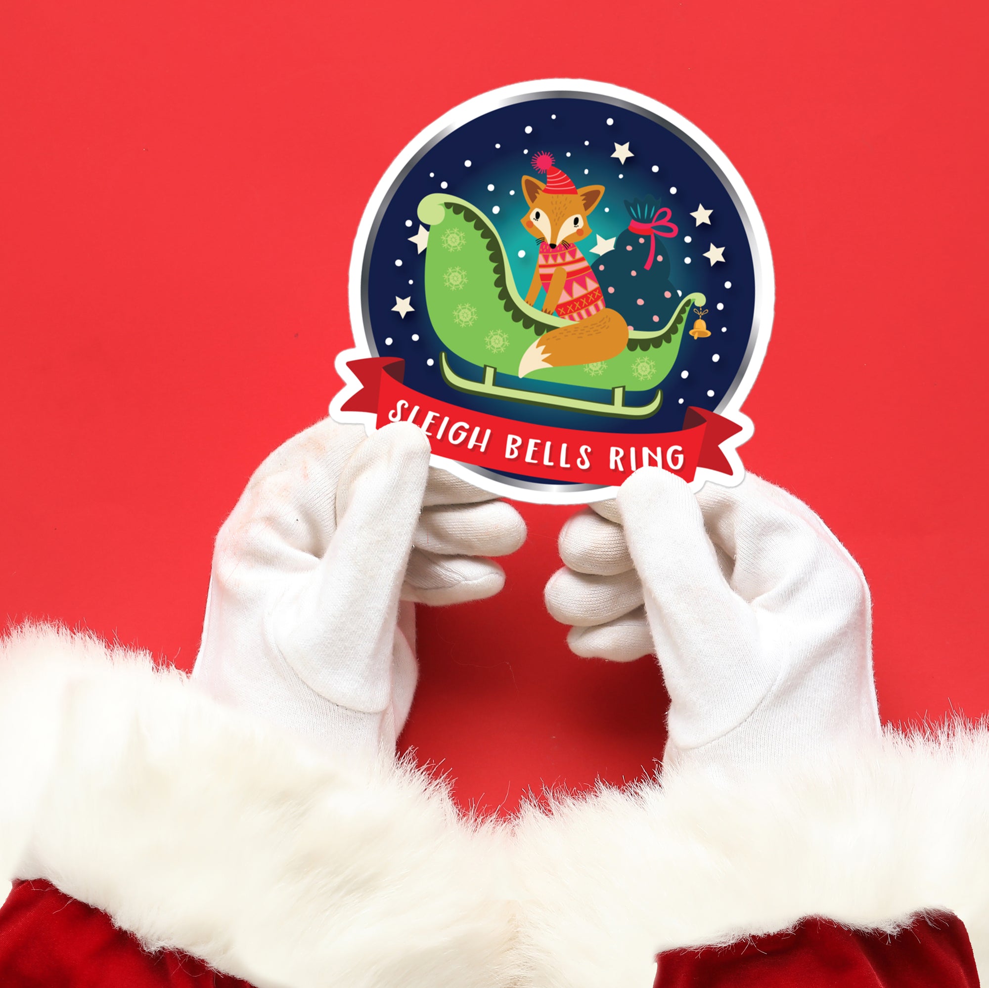 a person in a santa claus outfit holding a sticker