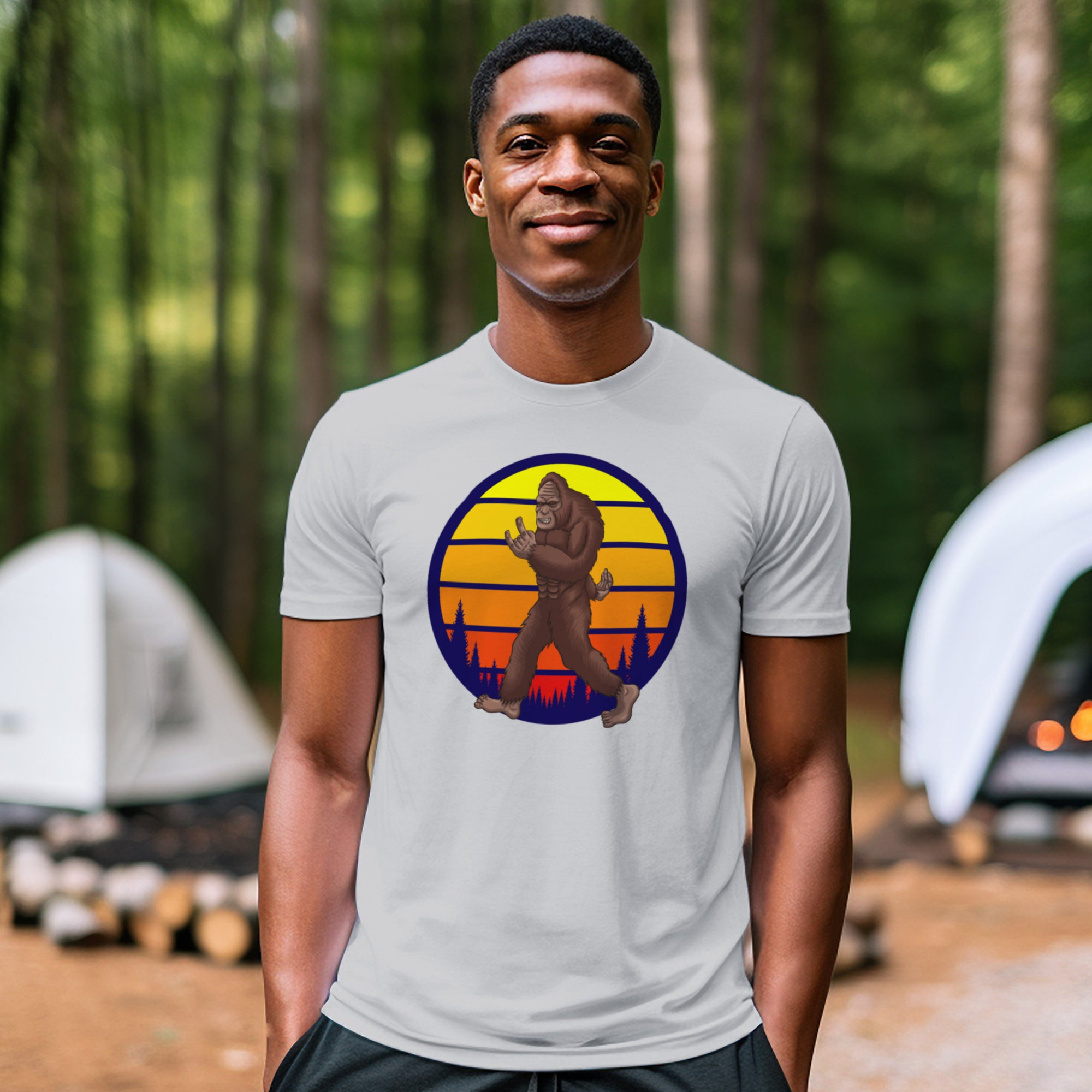 a man standing in front of a tent in the woods