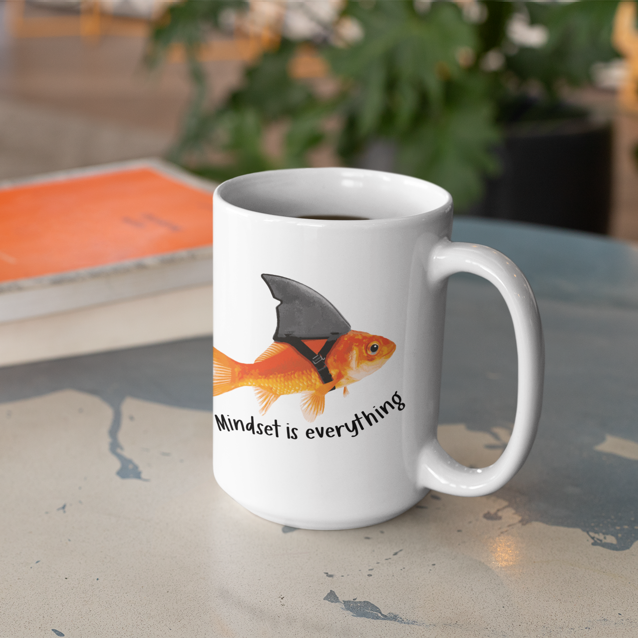 a white coffee mug with a fish on it