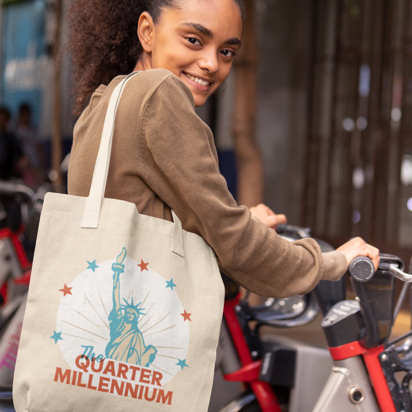 a woman is smiling while holding a bag