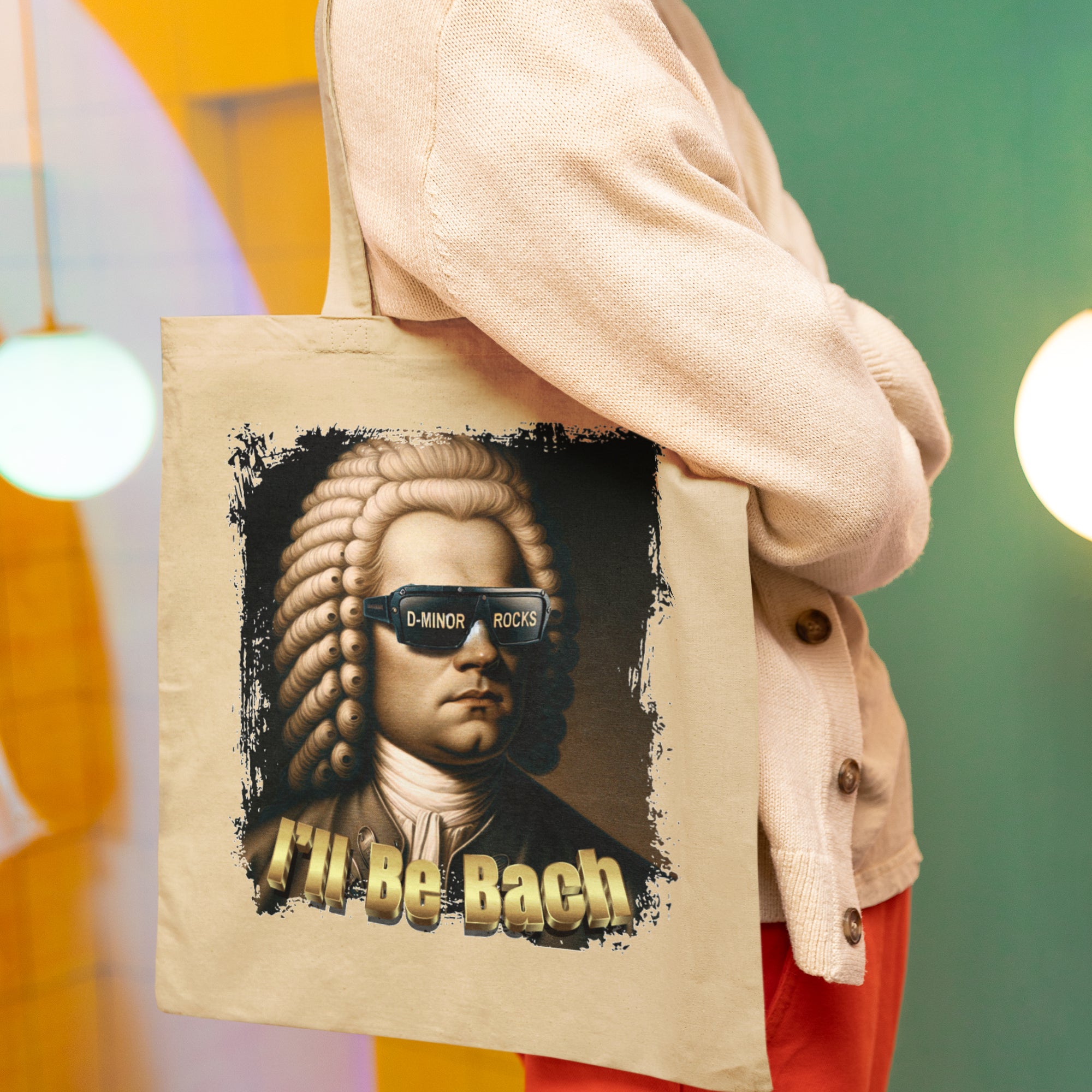 a person holding a tote bag with a picture of a man wearing sunglasses