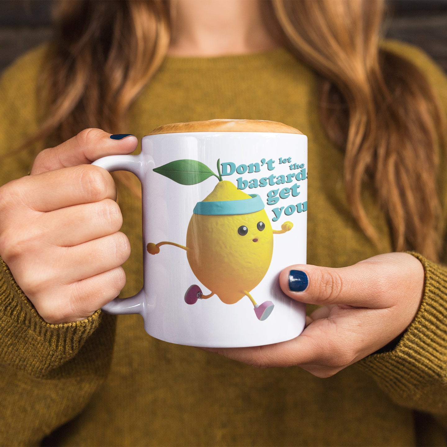 a woman holding a coffee mug with a lemon on it