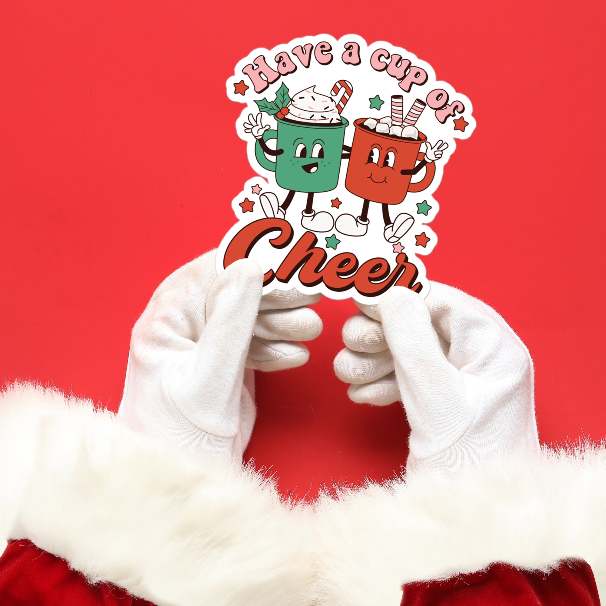 a person in a santa suit holding up a sticker