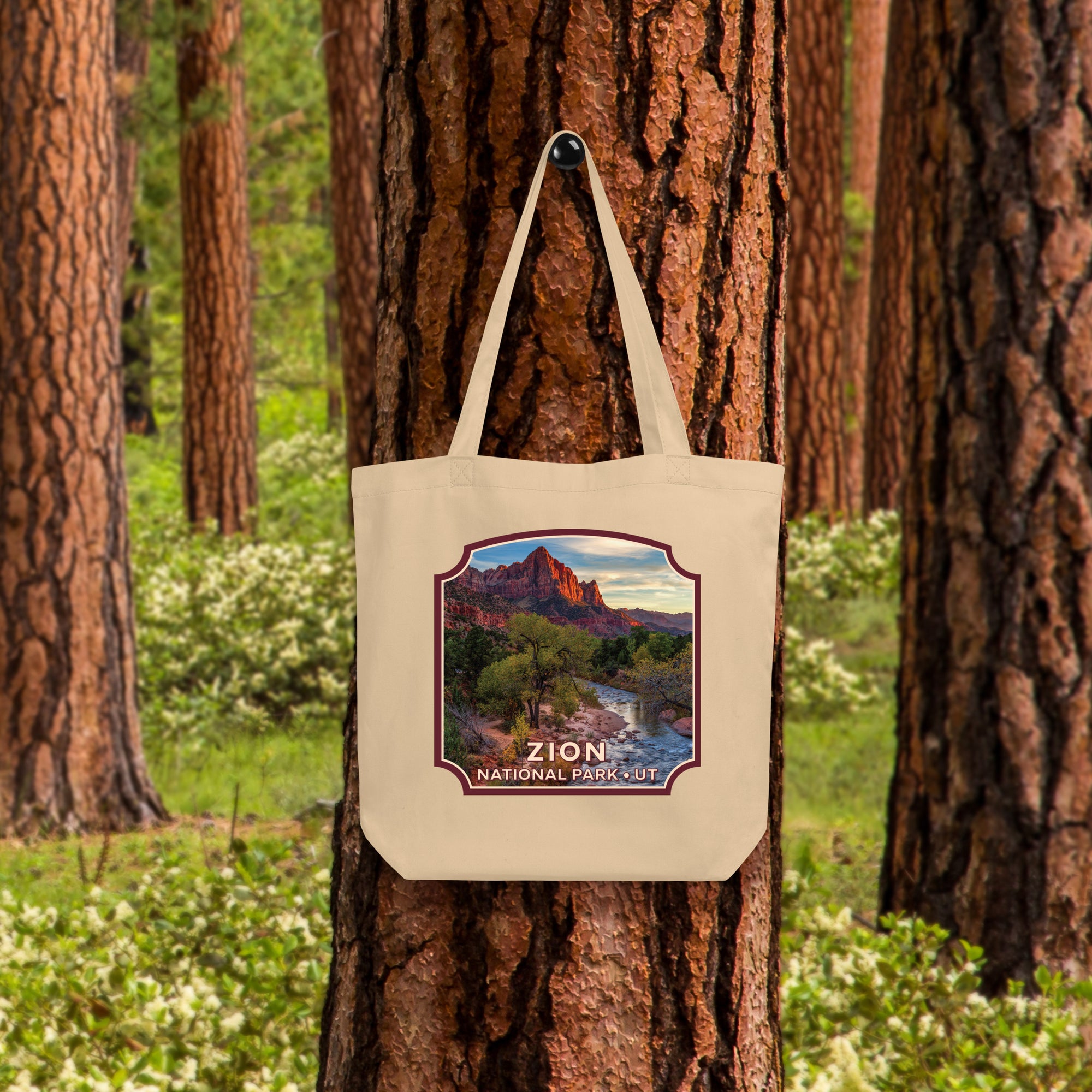 a tote bag hanging on a tree in a forest