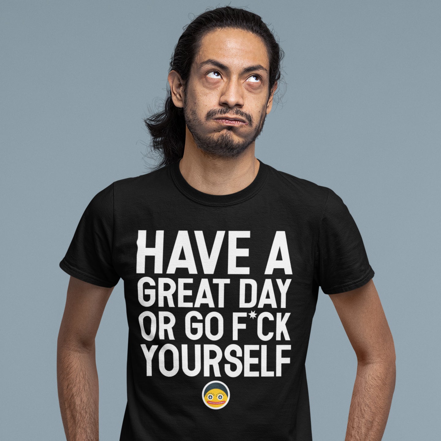 A man wearing a black t-shirt with the text "HAVE A GREAT DAY OR GO F*CK YOURSELF" printed on it.