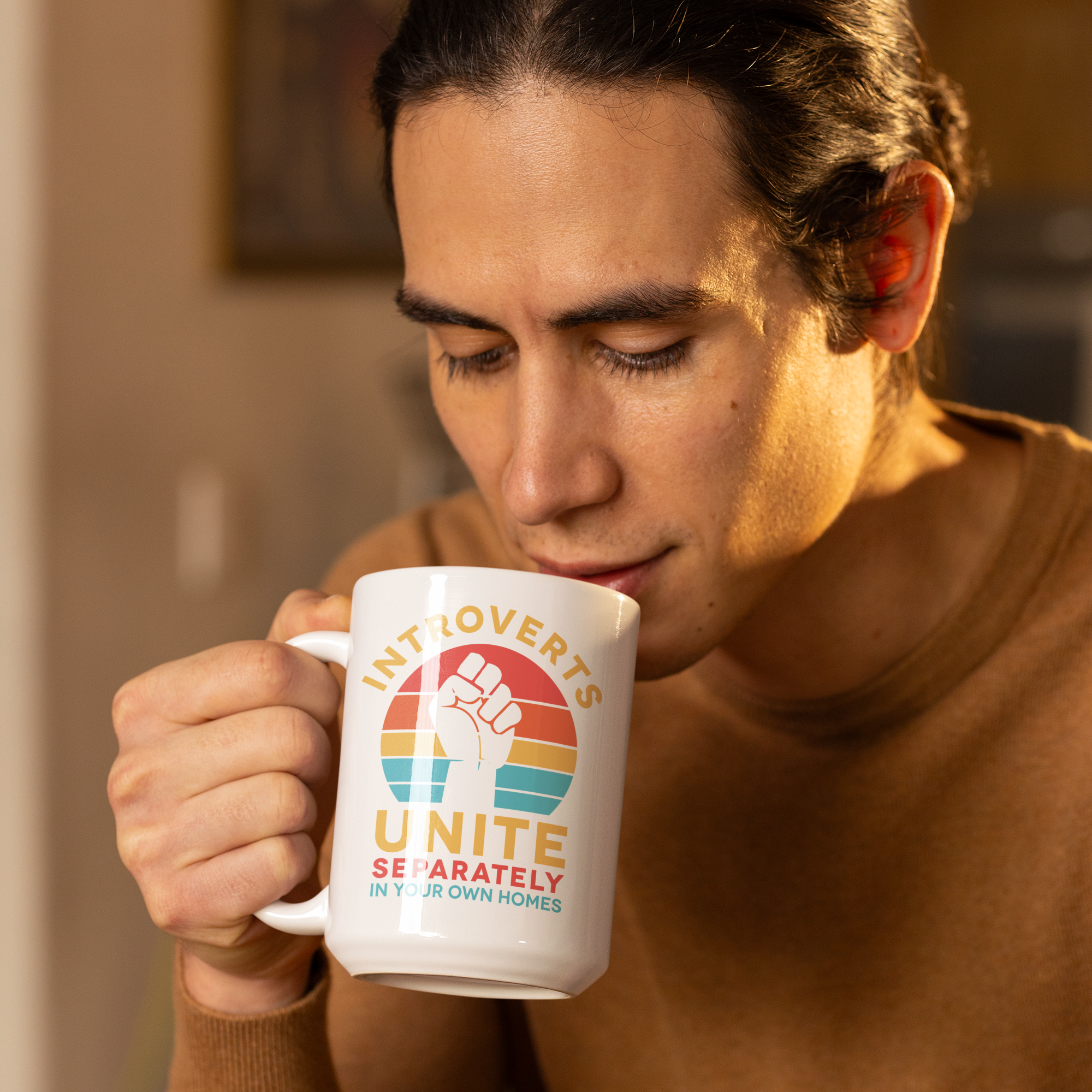 a man holding a coffee mug in his right hand