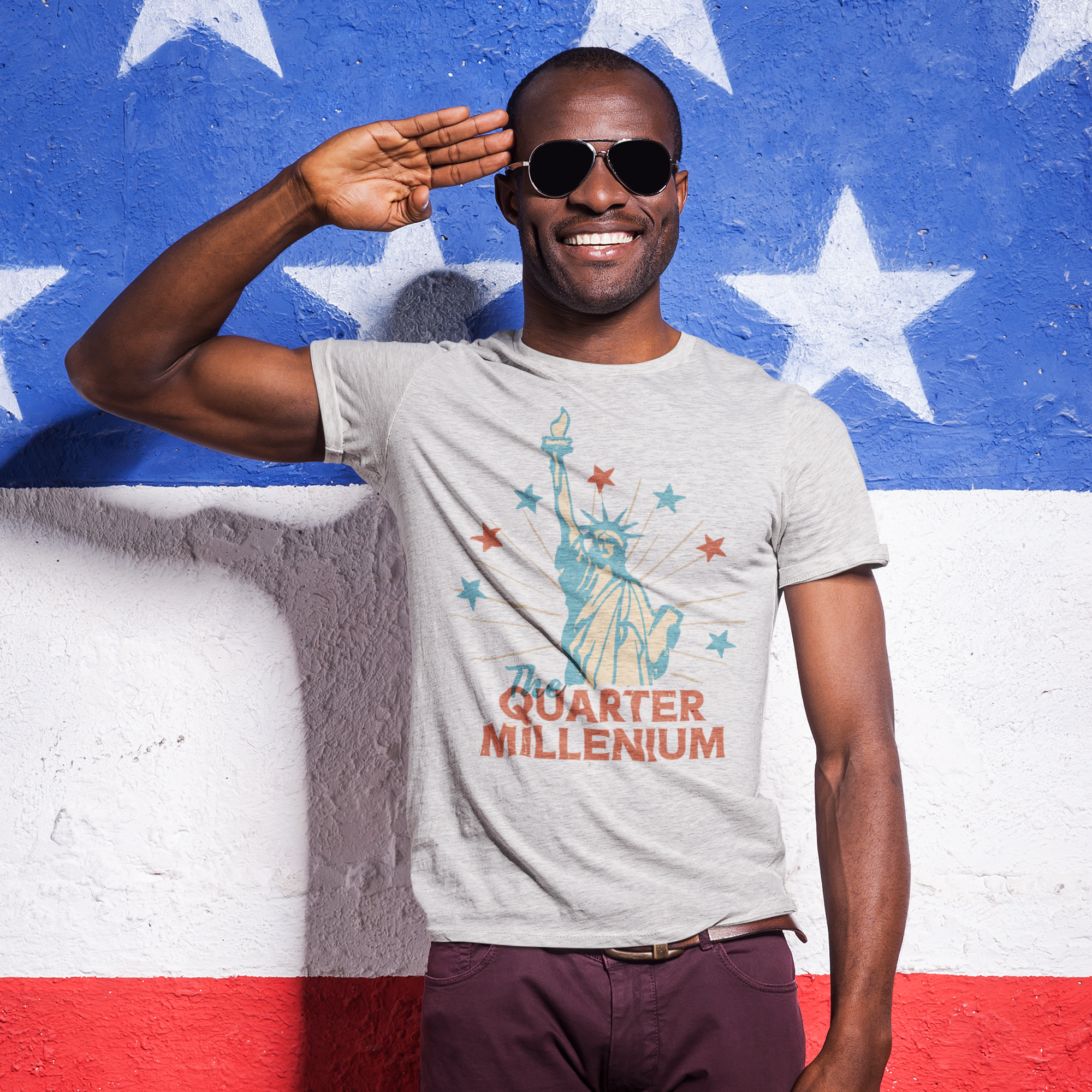 a man wearing a t - shirt with the statue of liberty on it