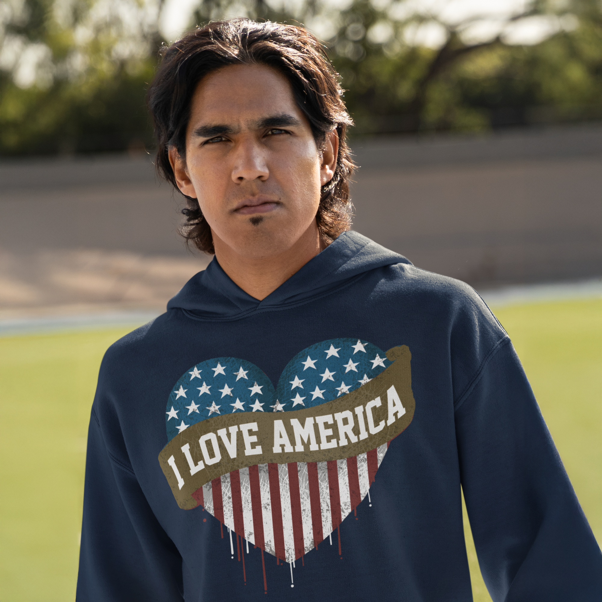 a young man wearing a hoodie with an american heart painted on it