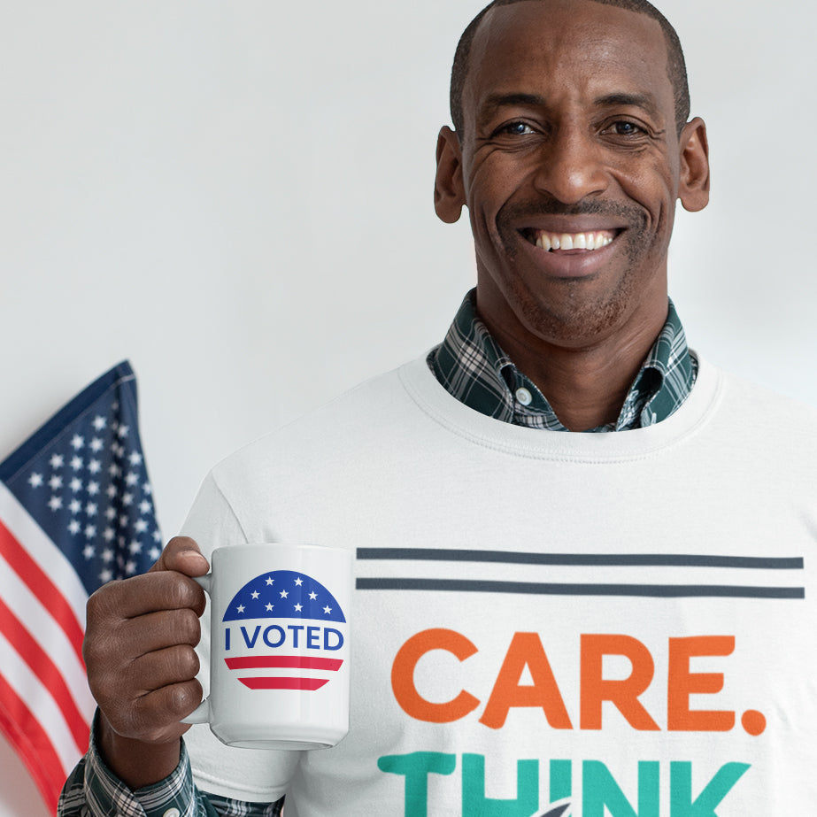 a man holding a coffee mug with a political message on it