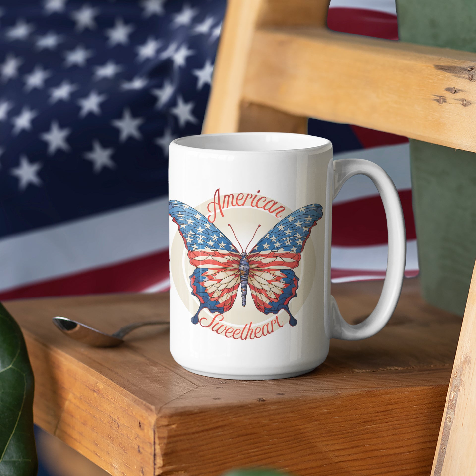 a white coffee mug with a butterfly on it