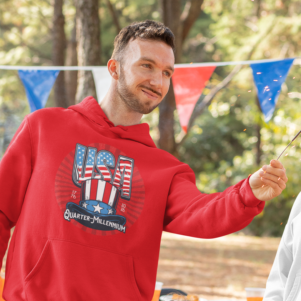 a man in a red hoodie holding a stick