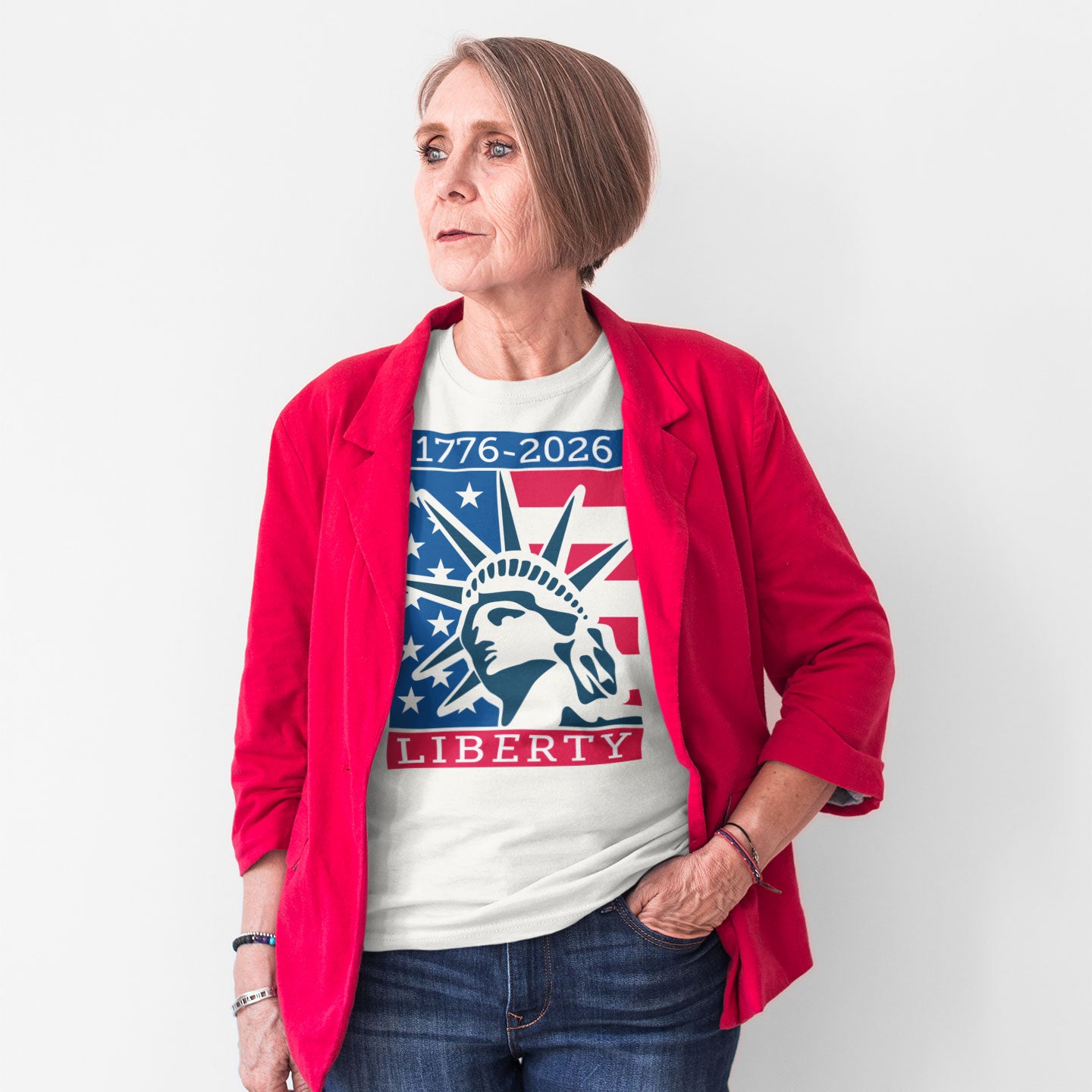 a woman wearing a red jacket and liberty t - shirt