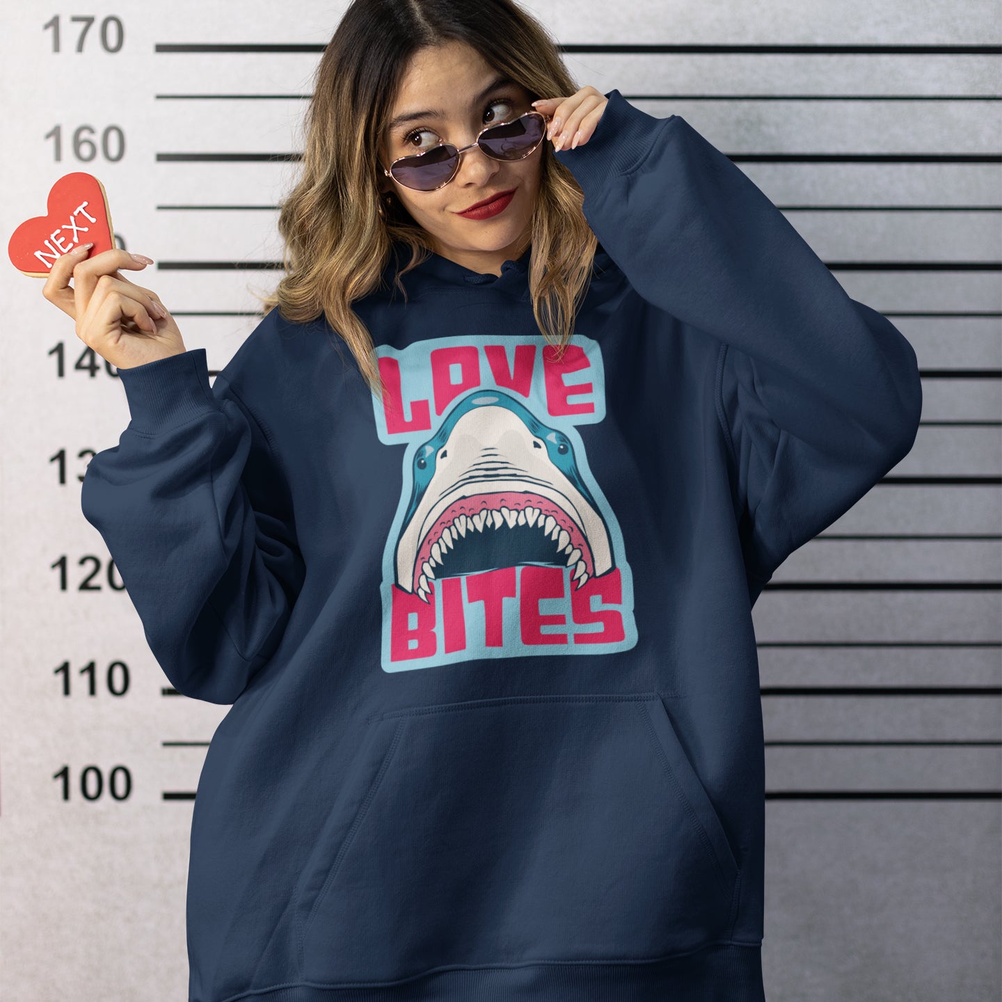 a woman wearing a sweatshirt with a shark on it