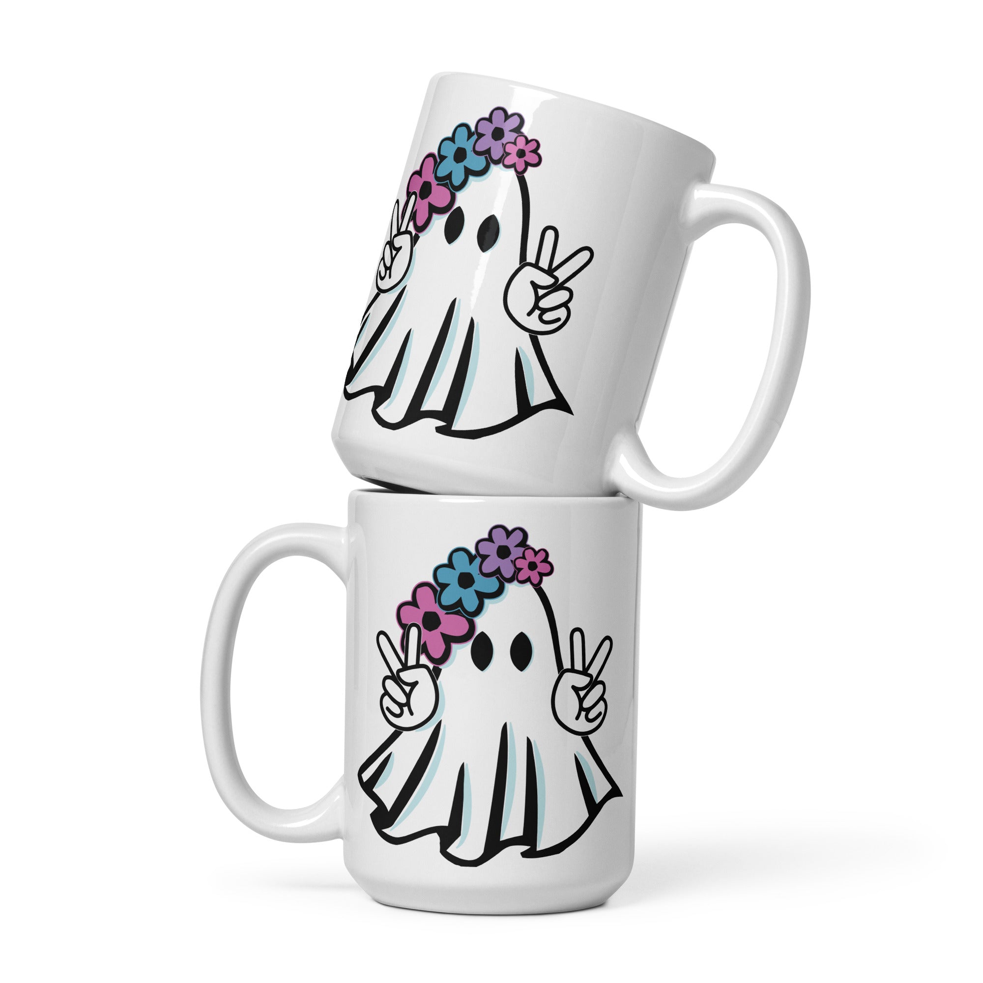 two white coffee mugs with ghost faces on them