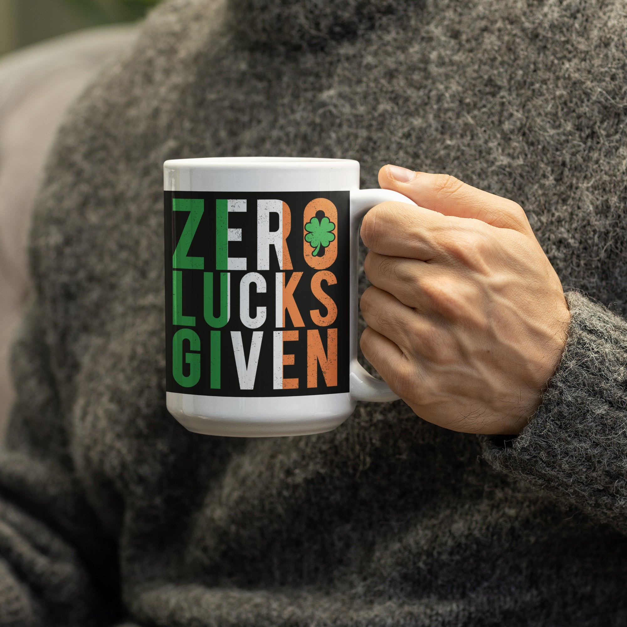 a person holding a coffee mug with the words zero luck's given on it