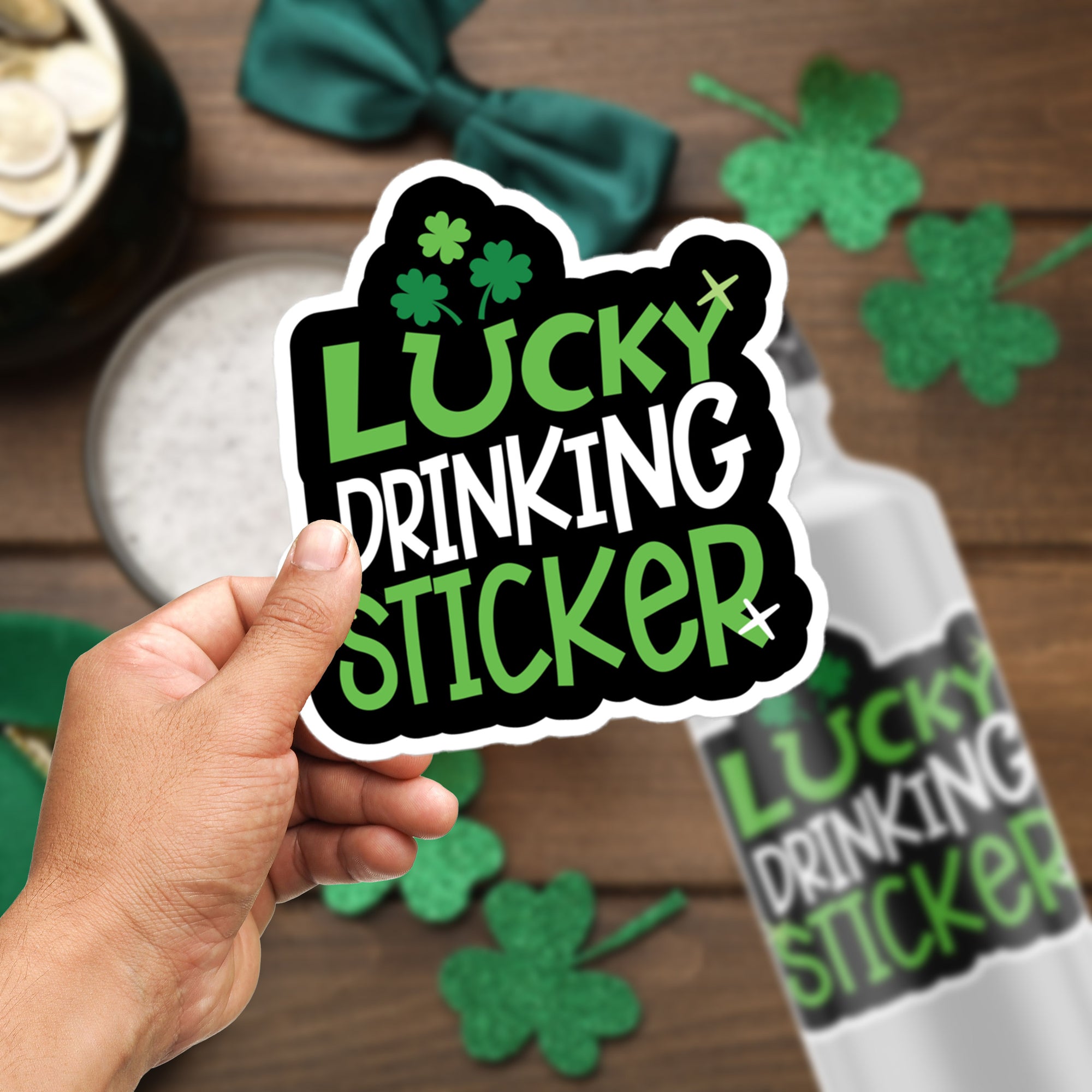 a hand holding a sticker that says lucky drinking sticker