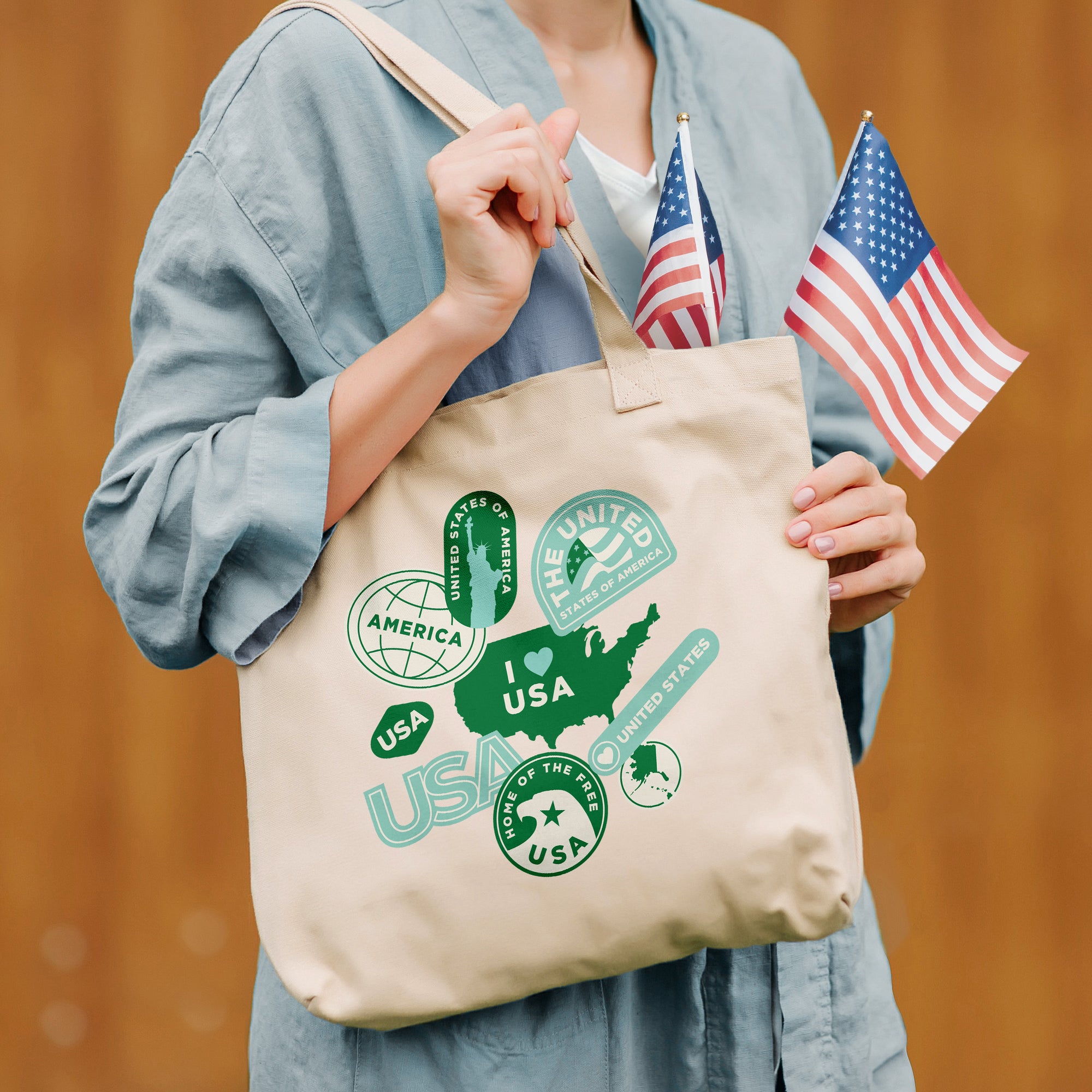 a woman holding a tote bag with an american flag