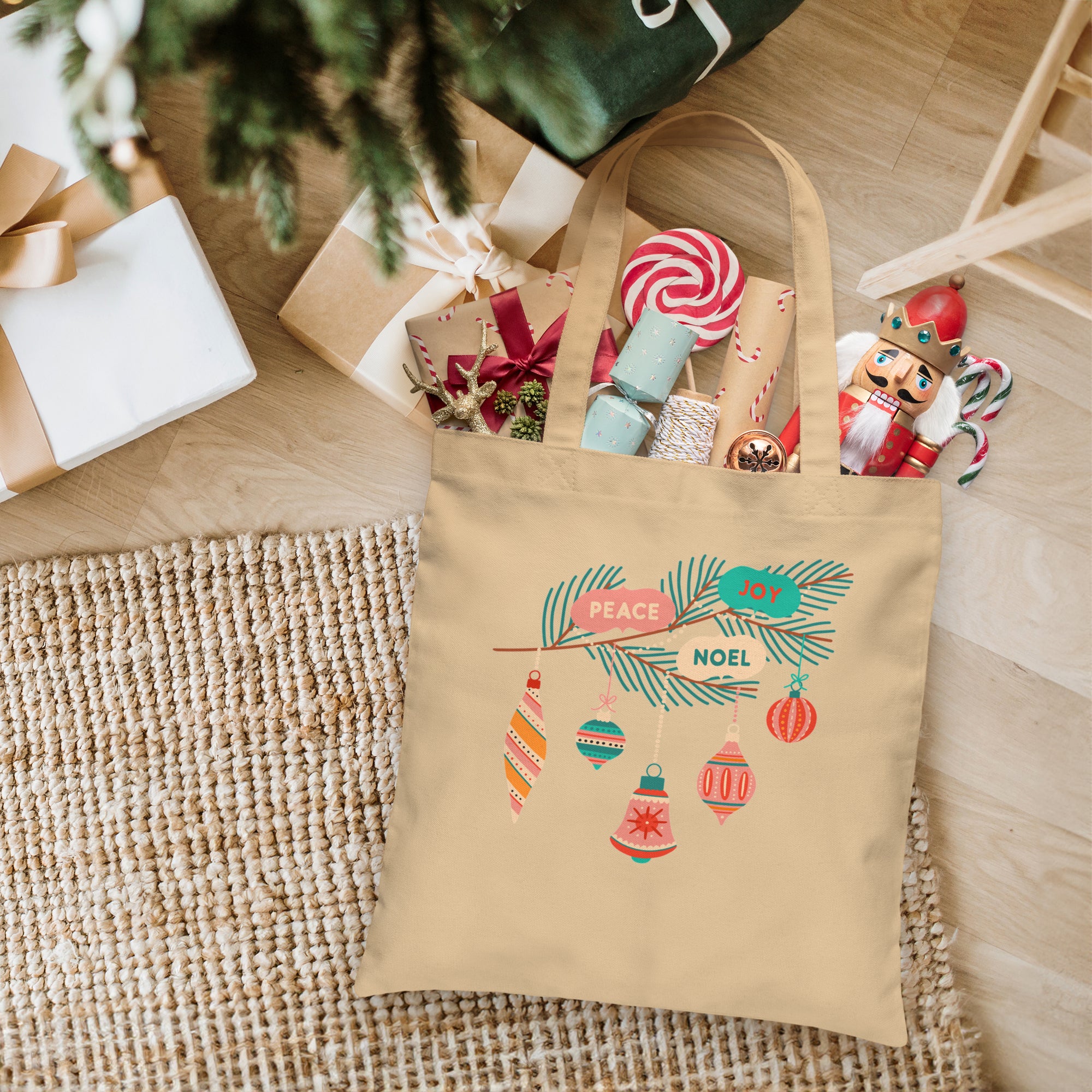 a bag with a christmas message on it next to a christmas tree