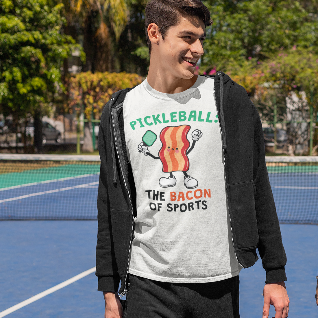 a man standing on a tennis court holding a racquet