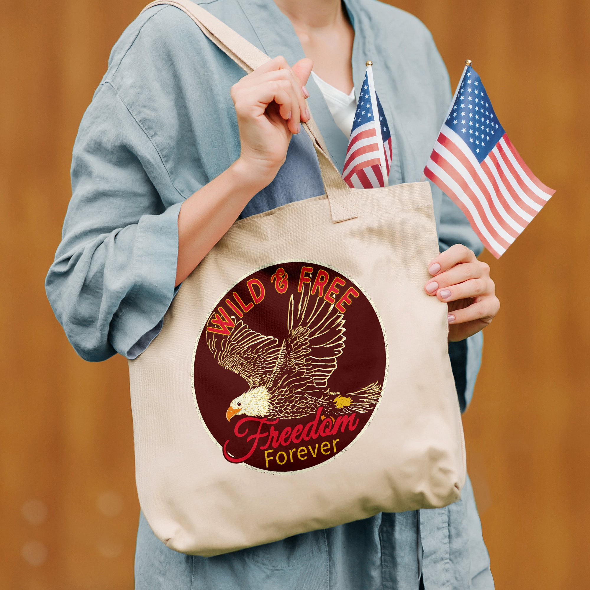 a woman holding a tote bag with an american flag