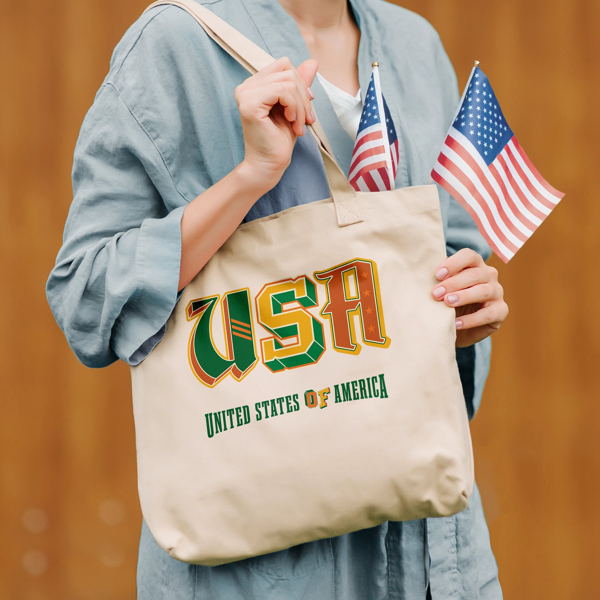 a woman holding a united states of america tote bag