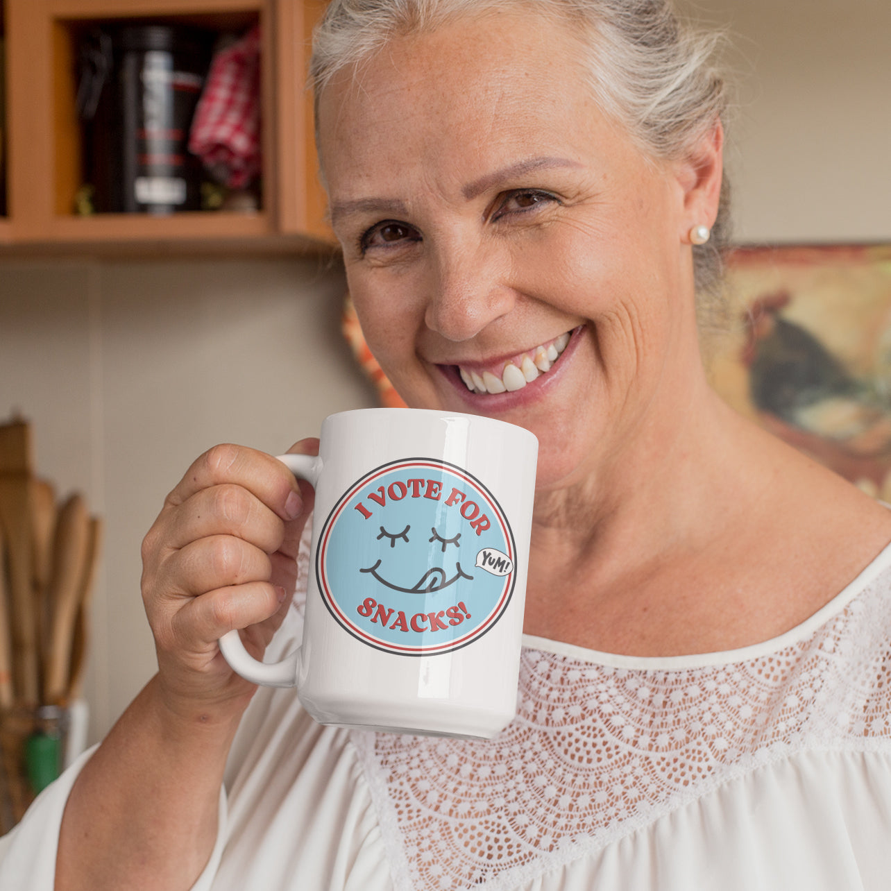 a woman holding a coffee mug with a smiley face on it