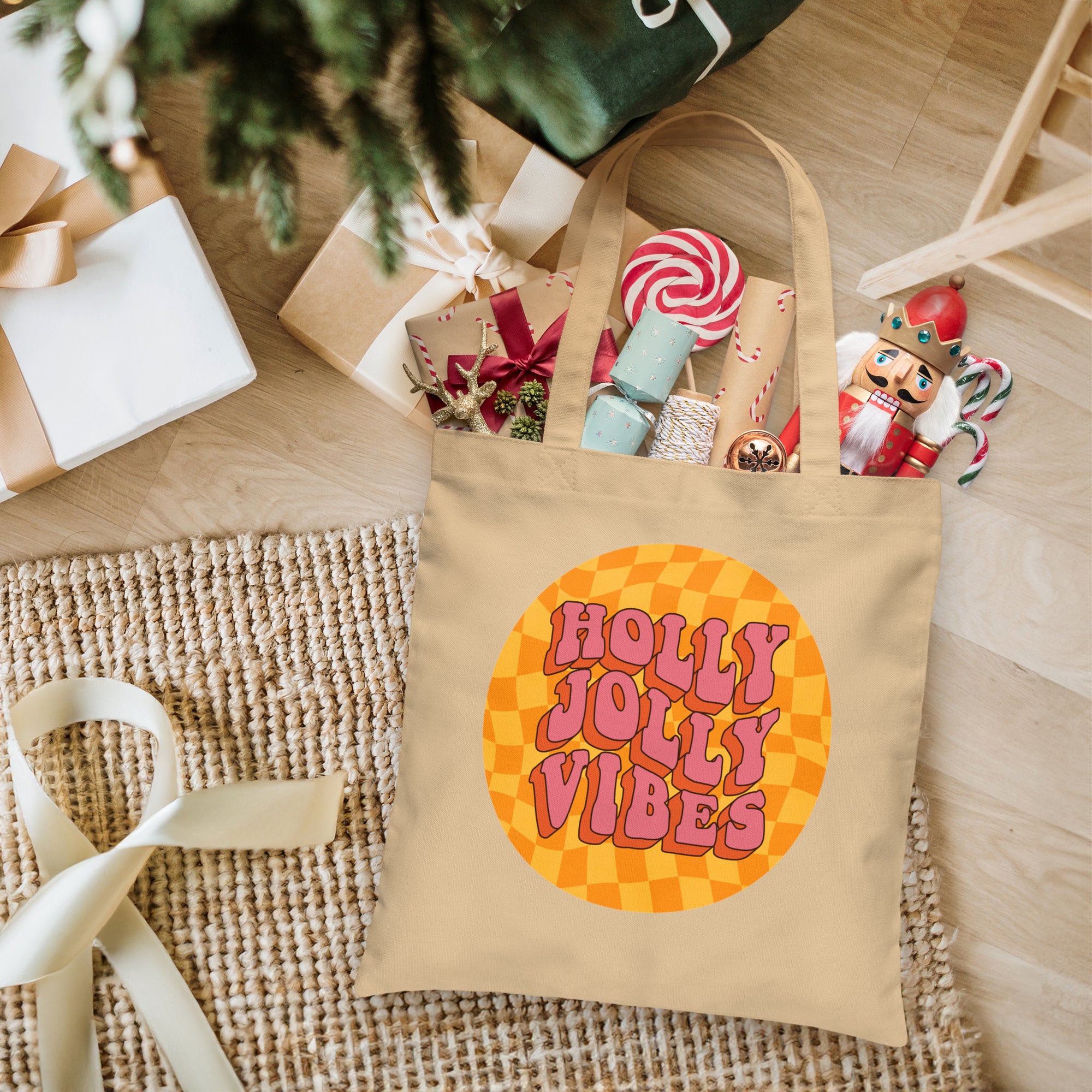 a tote bag sitting on top of a table next to a christmas tree