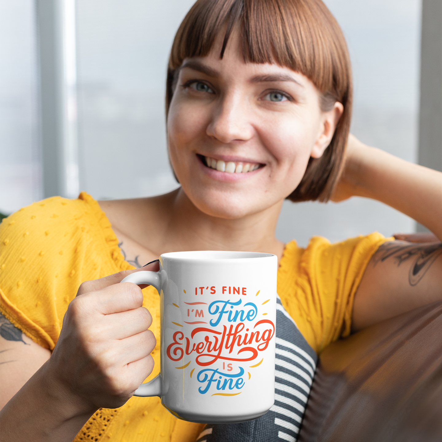 a woman holding a coffee mug in her hand