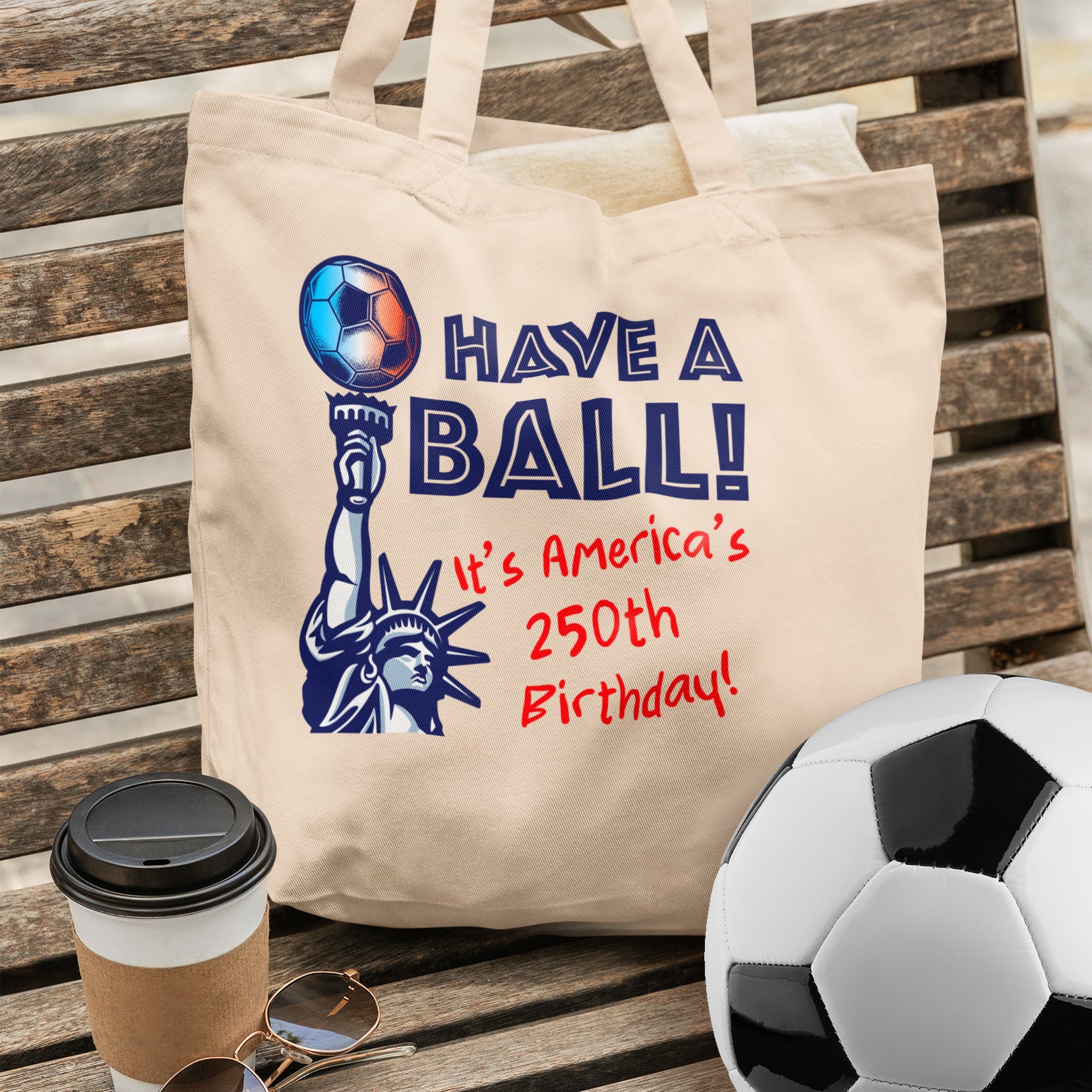 a tote bag with a picture of the statue of liberty and a soccer ball