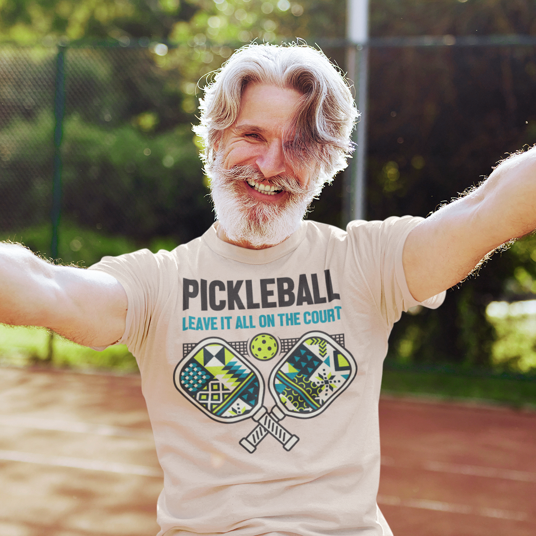 a man with a white beard and a pickleball t - shirt