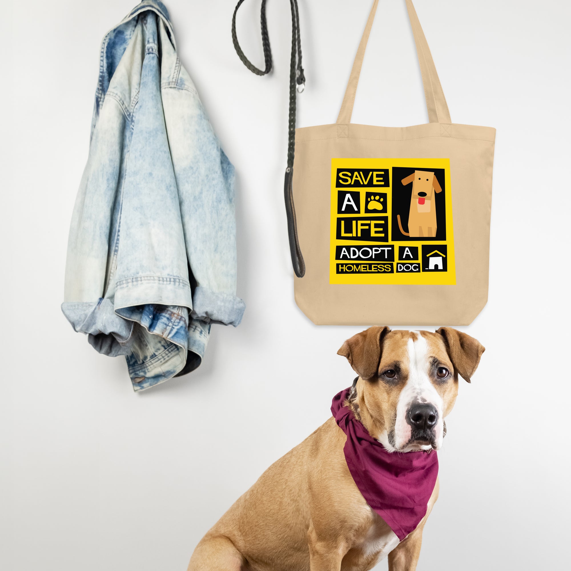 a brown dog sitting next to a tote bag