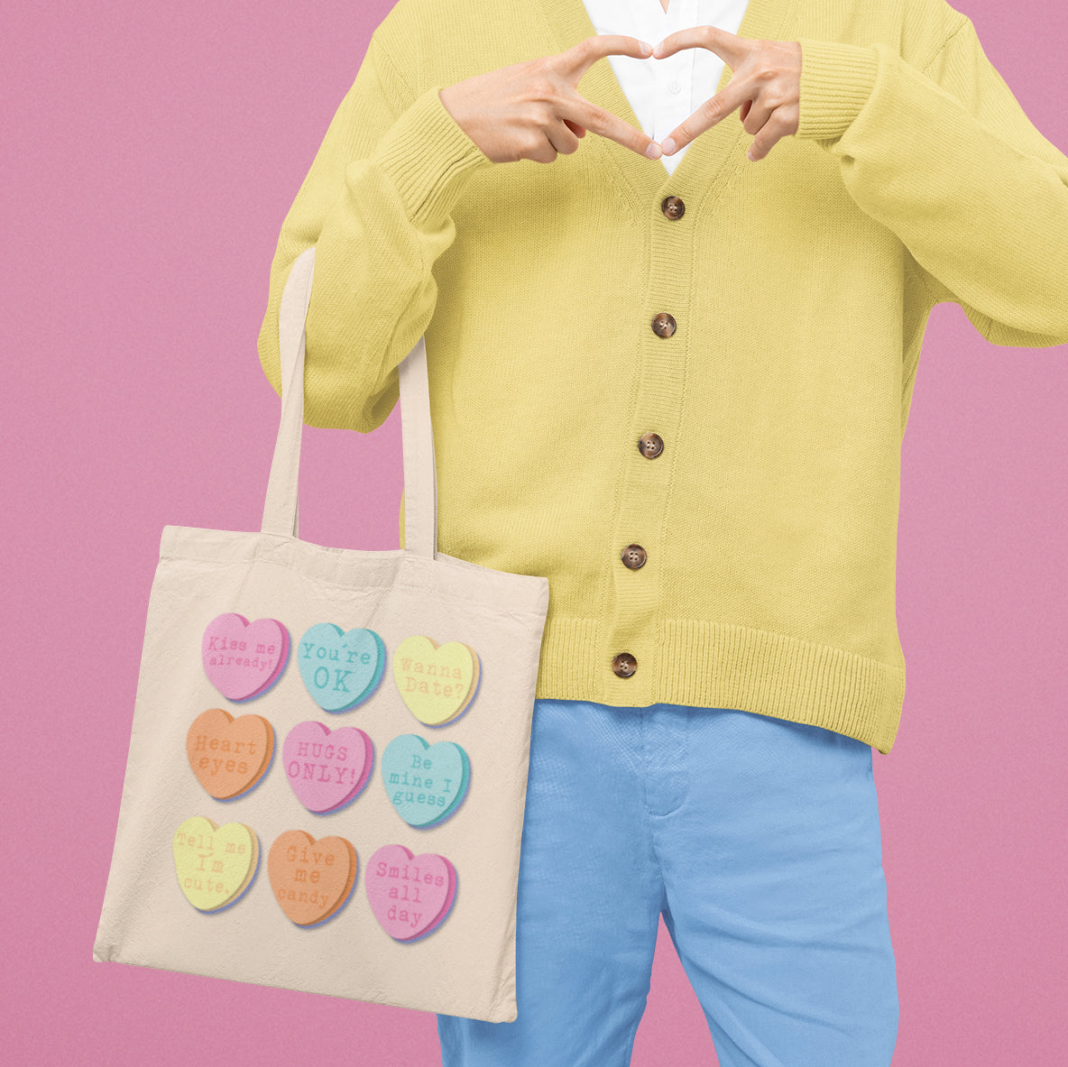 a person holding a bag with hearts on it