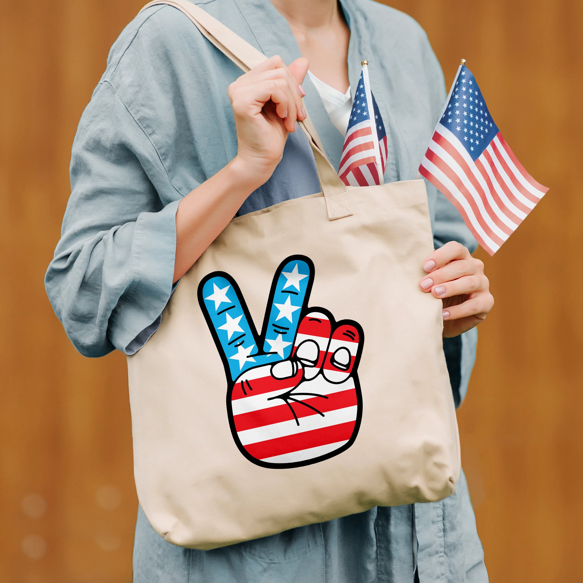 a woman holding a bag with a peace sign painted on it