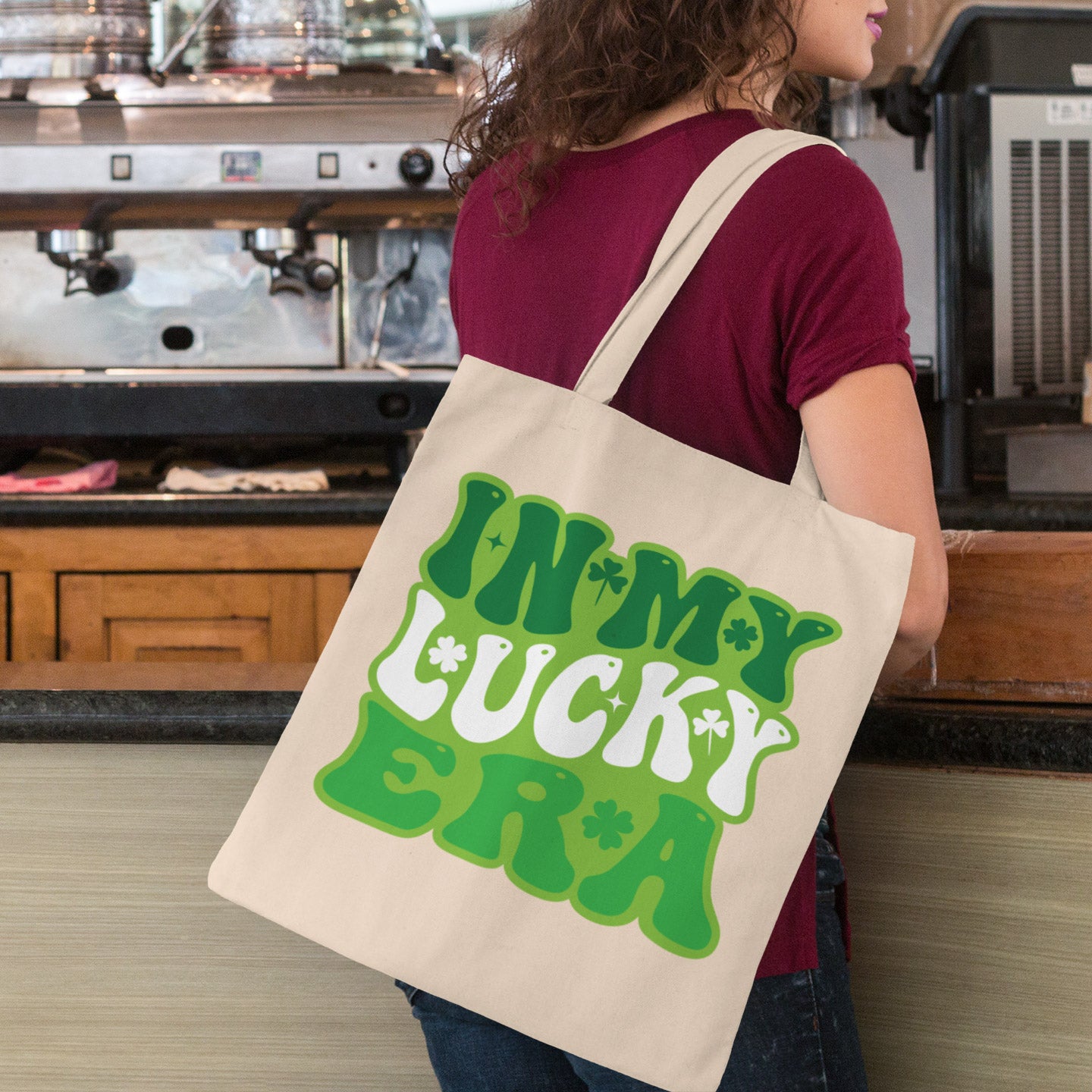 a woman carrying a tote bag in a coffee shop