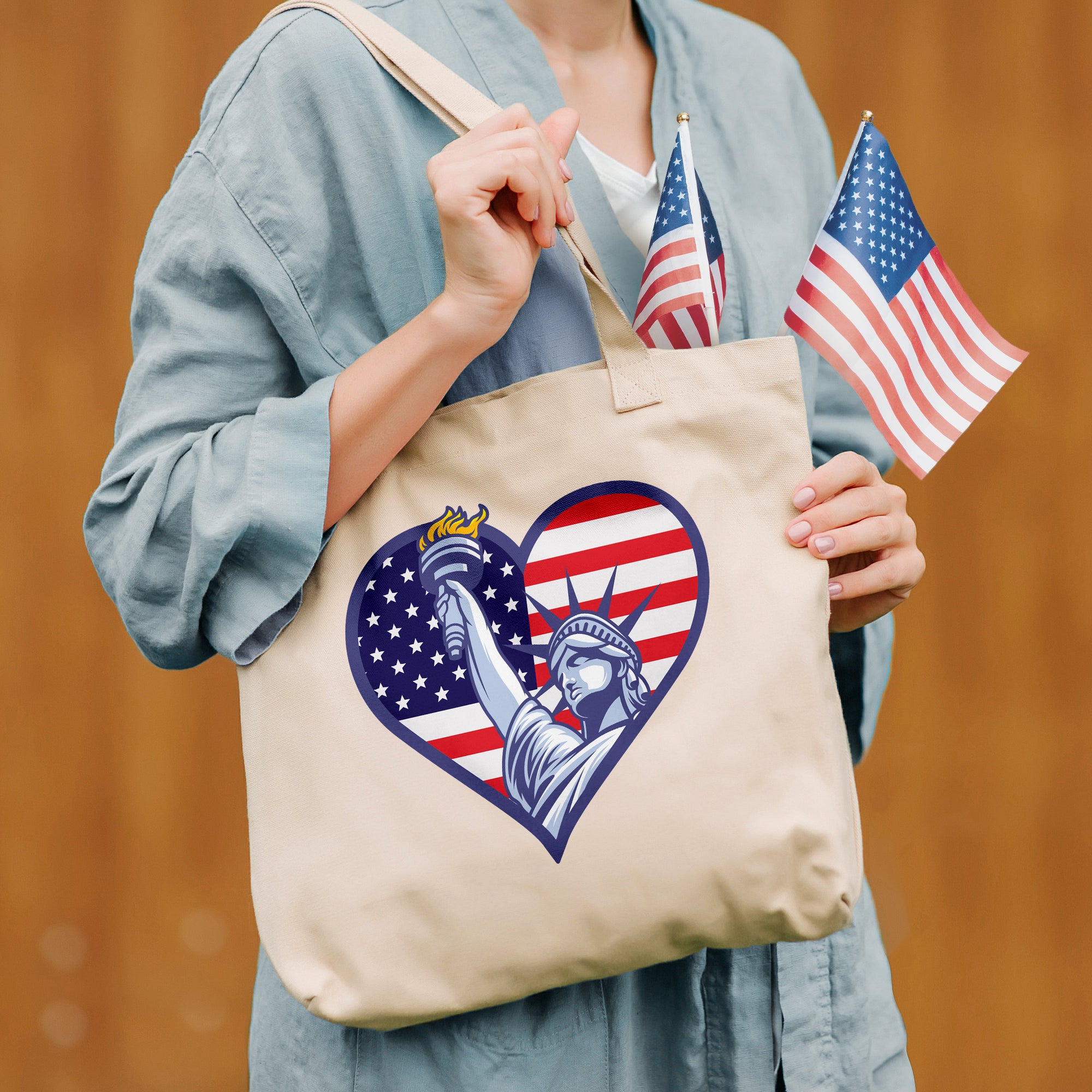 a woman holding a bag with a statue of liberty on it