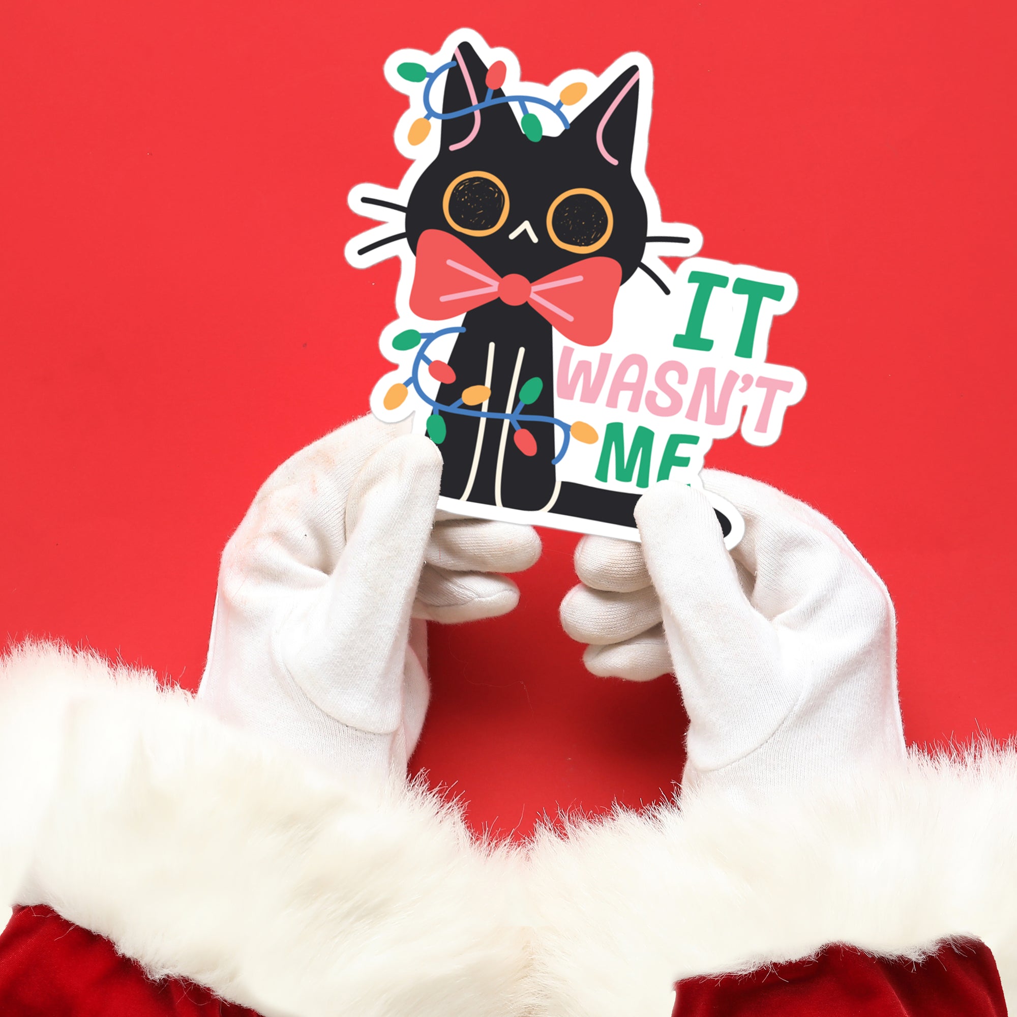 a person in a santa suit holding up a sticker