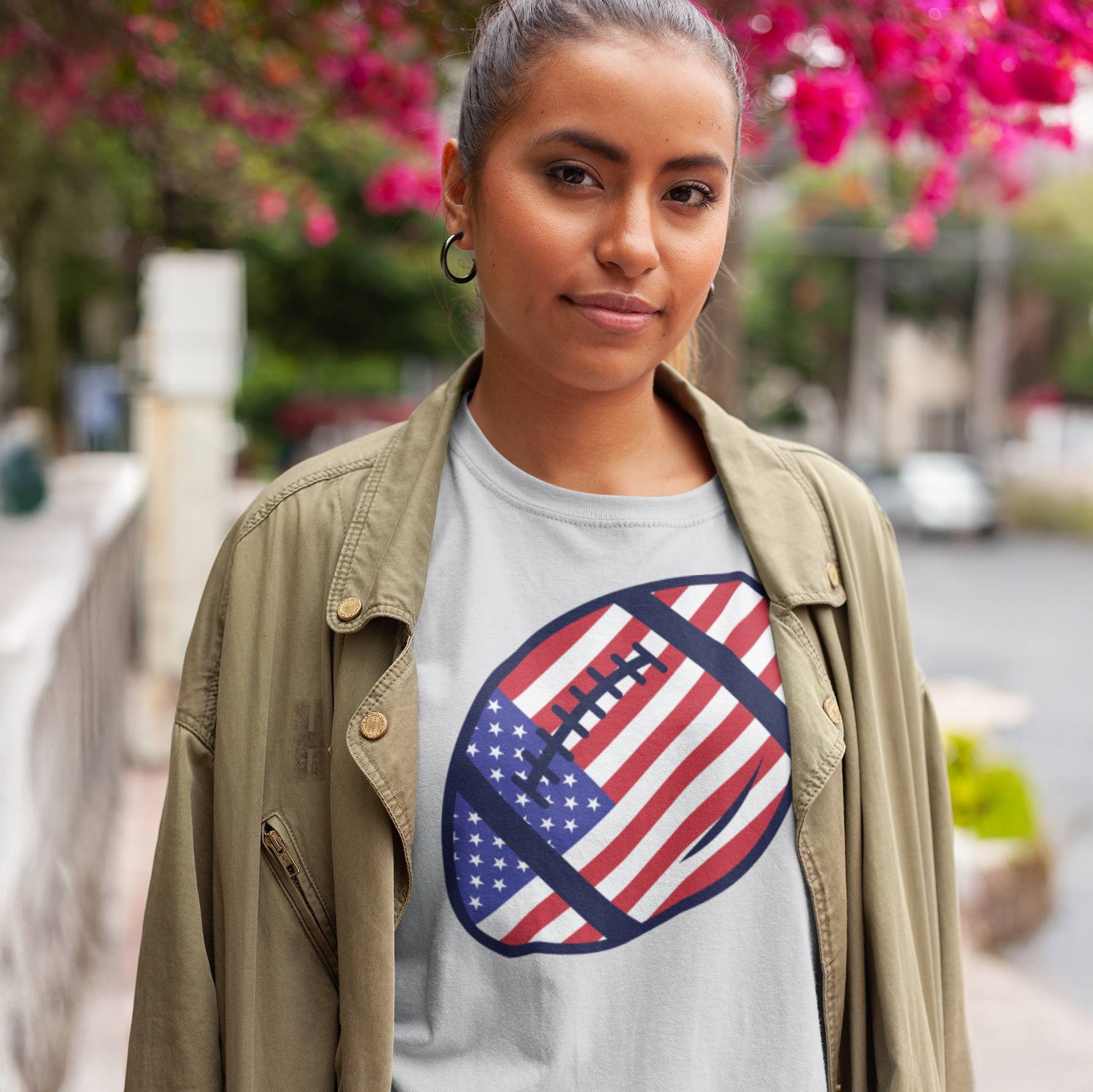 a woman wearing a t - shirt with an american flag on it