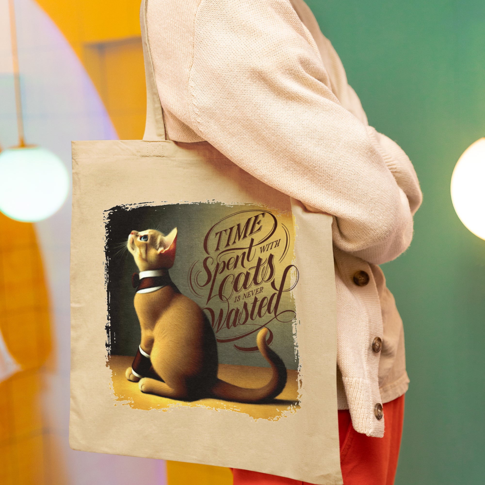 a woman holding a bag with a picture of a cat on it