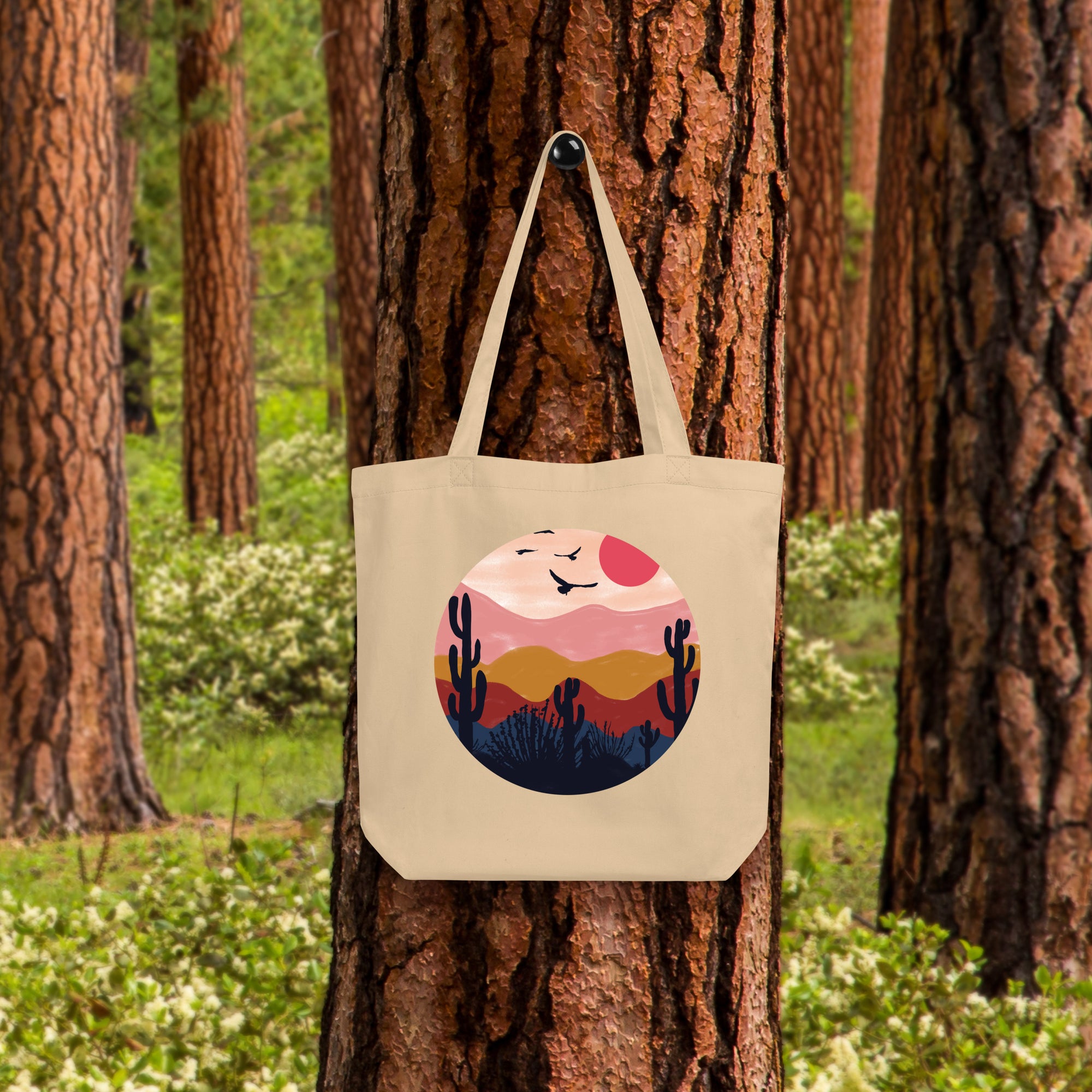 a tote bag hanging on a tree in a forest