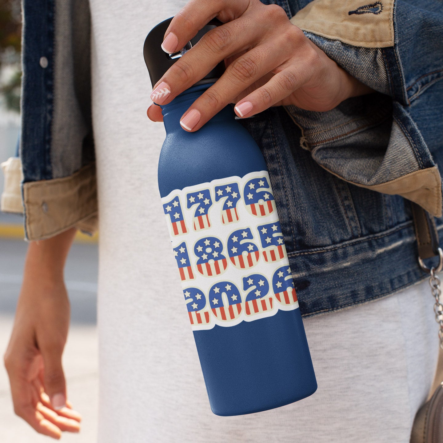 a woman is holding a blue water bottle