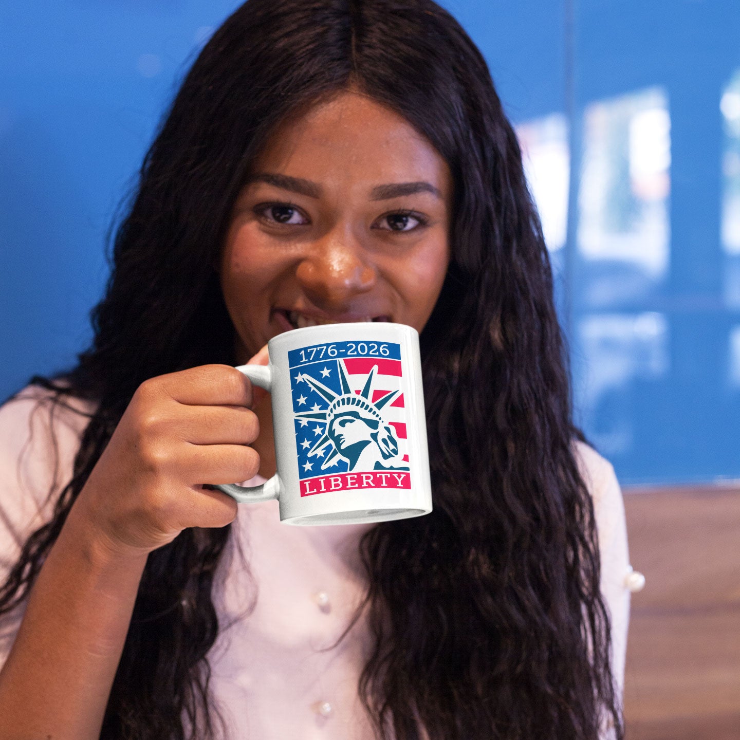 a woman is holding a coffee mug in her hand