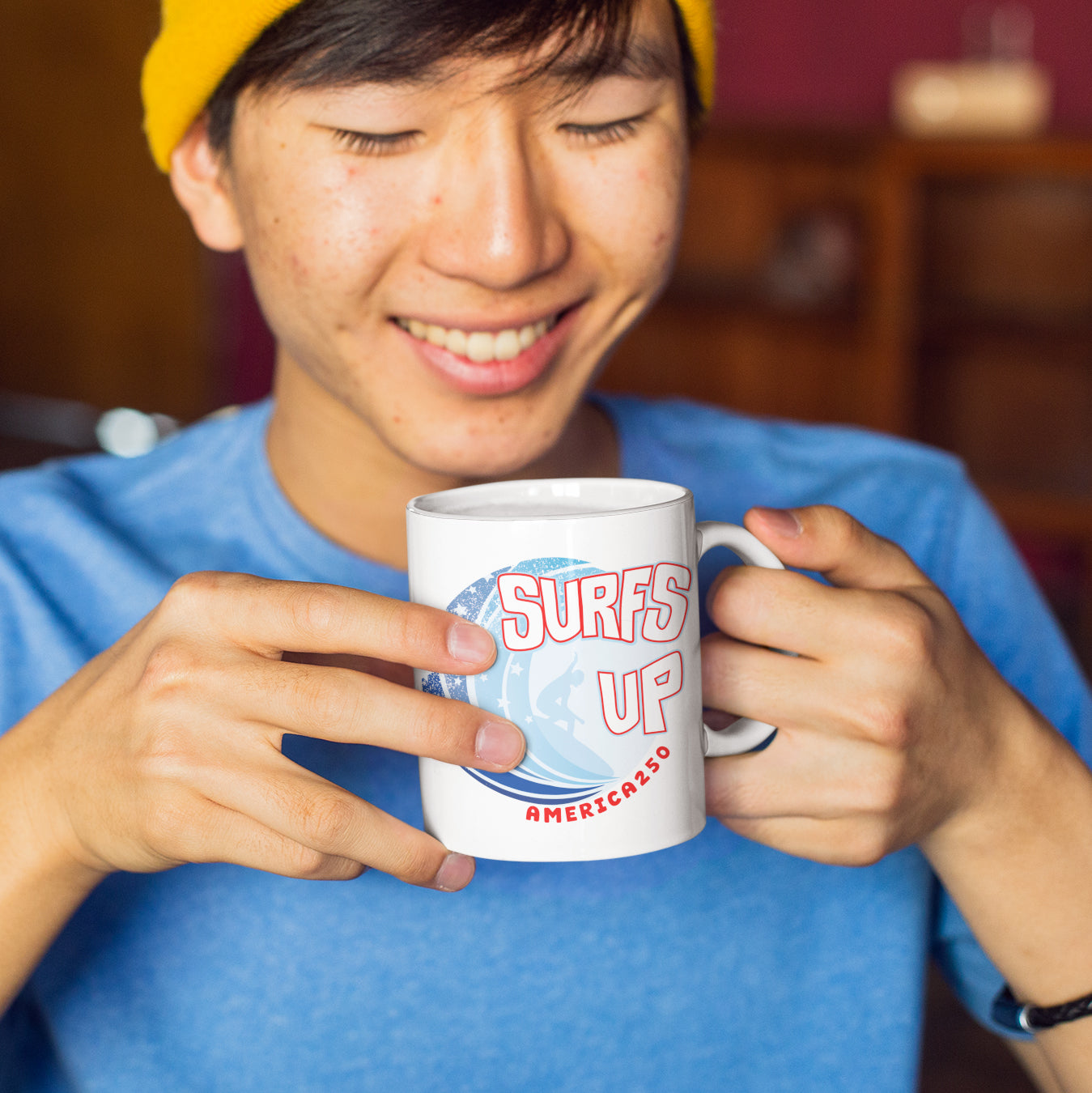 a man in a yellow hat is holding a coffee mug