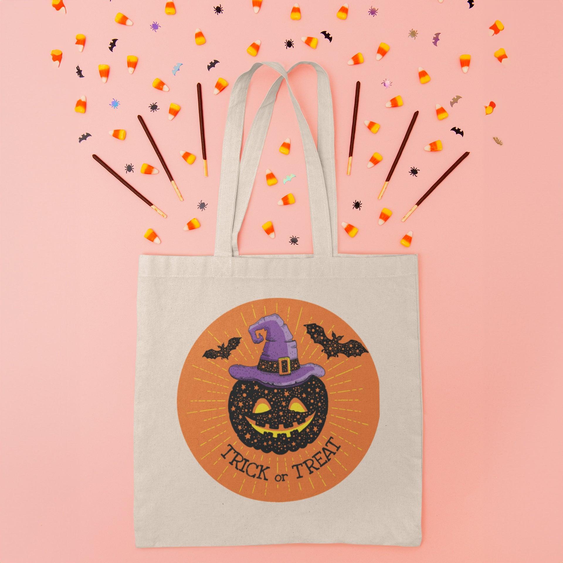 a trick or treat bag on a pink background