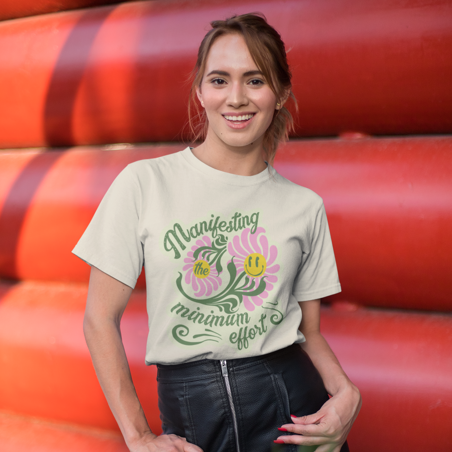 a woman standing in front of a stack of orange pipes