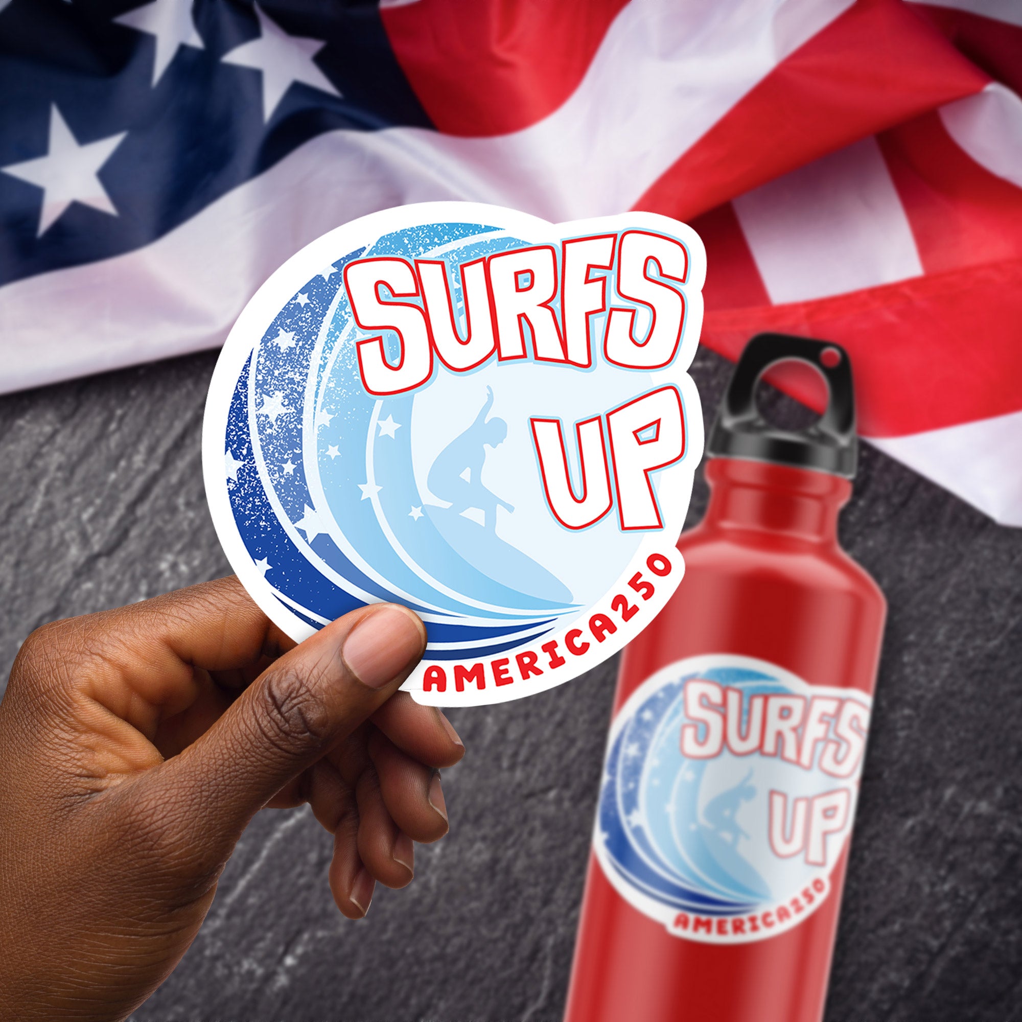 a person holding up a sticker that says surfs up