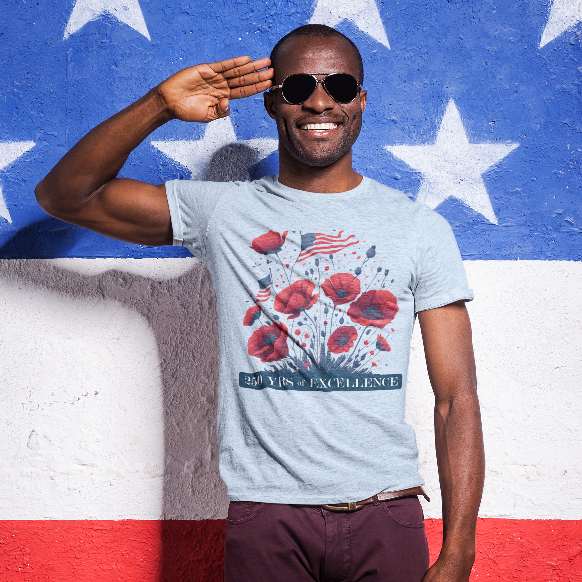 a man in a t - shirt and sunglasses standing in front of an american flag