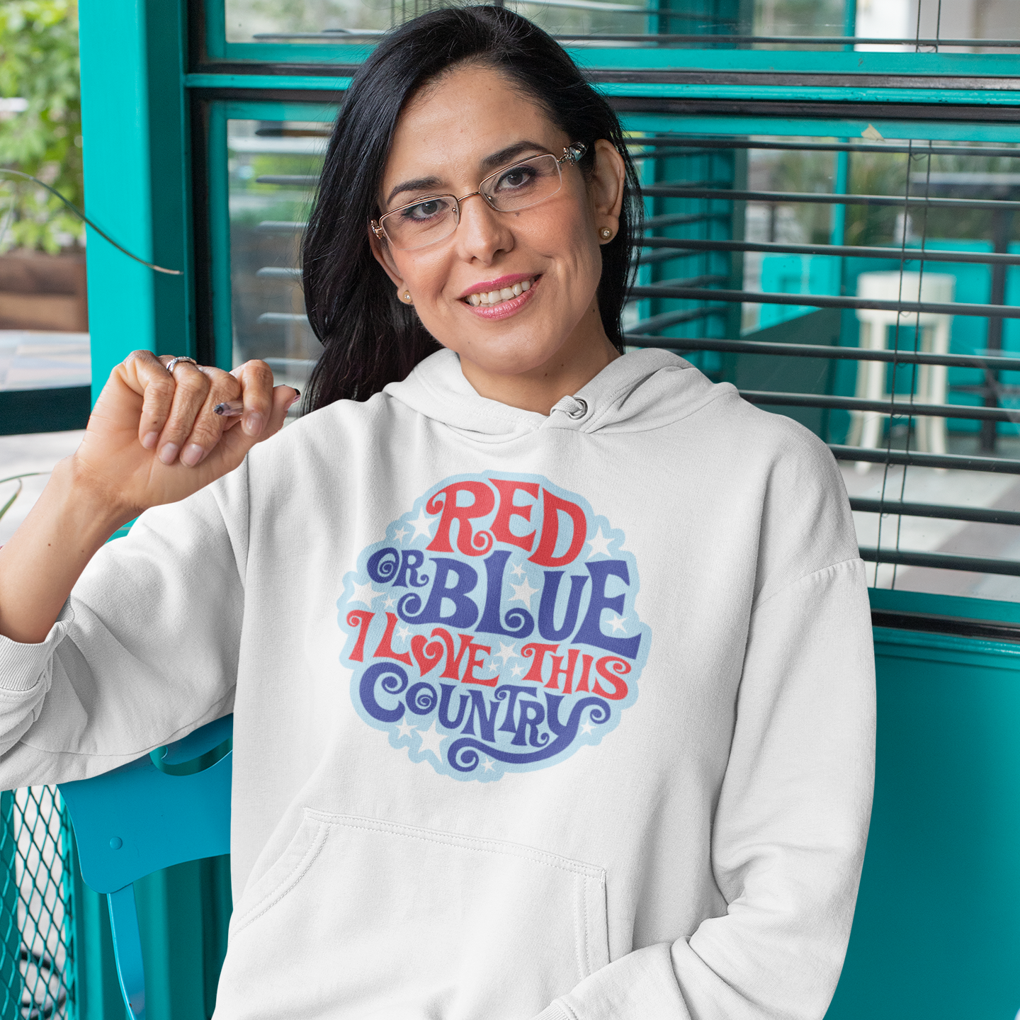 a woman wearing a red white and blue hoodie