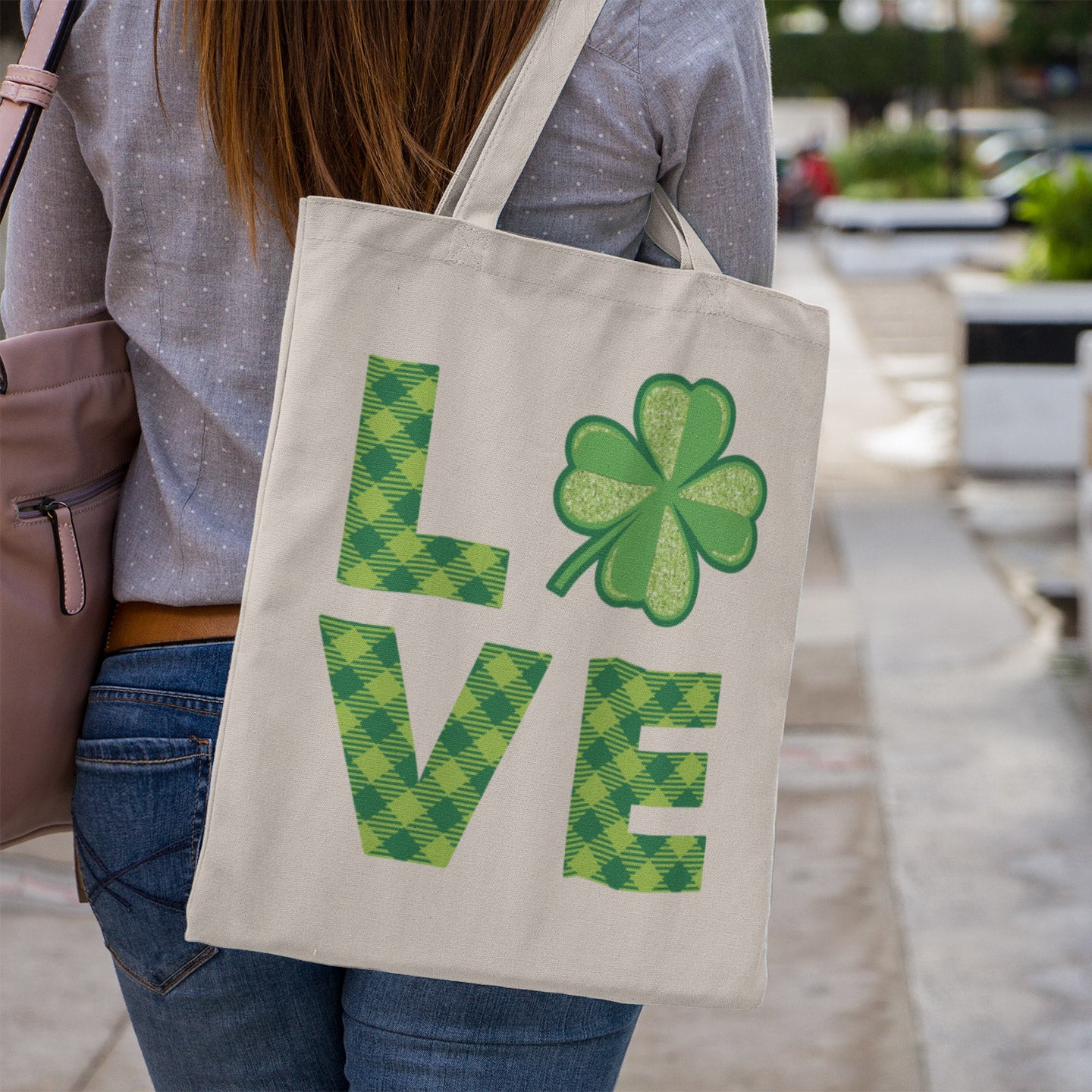 a woman carrying a st patrick's day tote bag